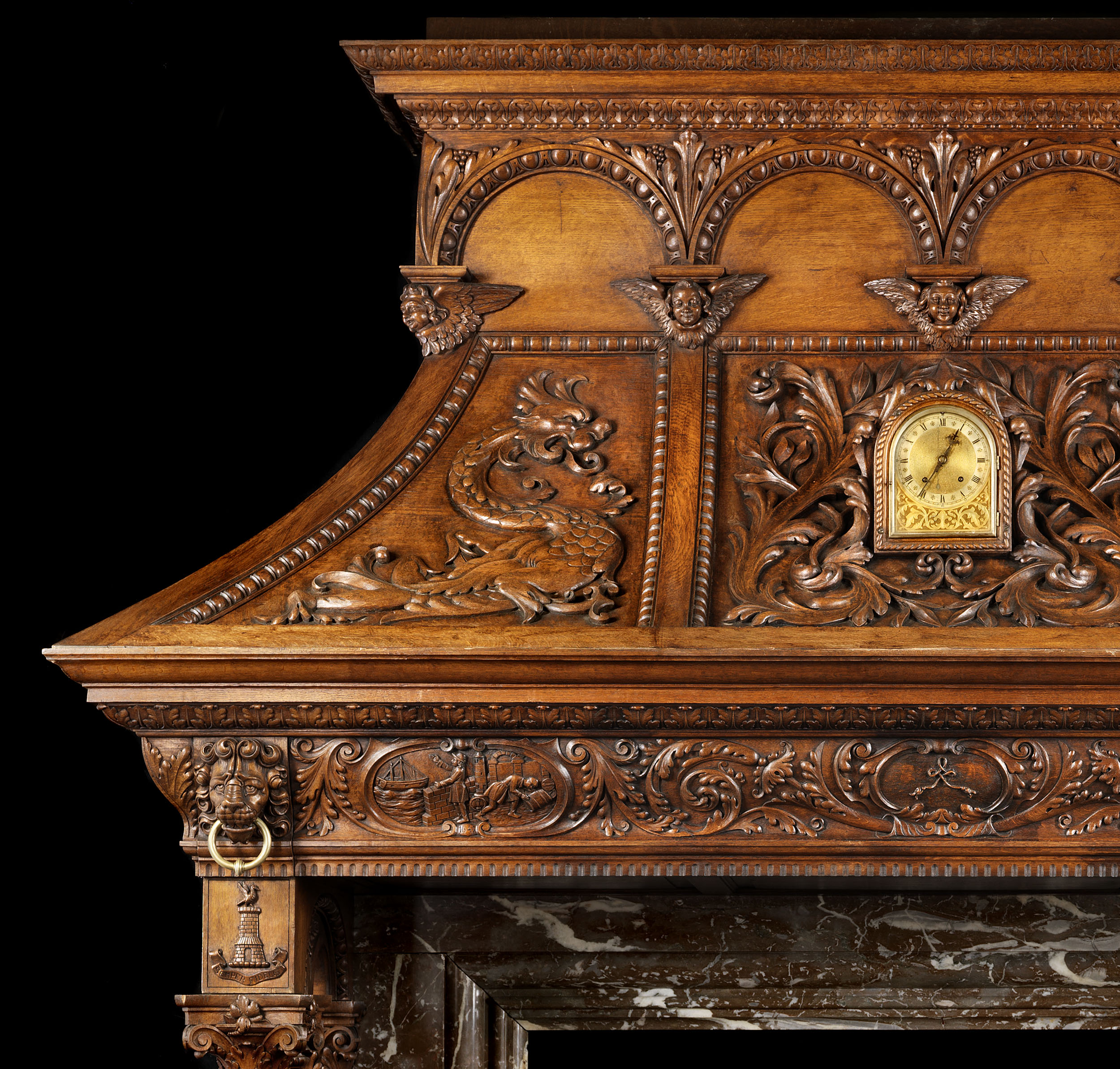  An Italian Renaissance Revival oak fireplace mantel    