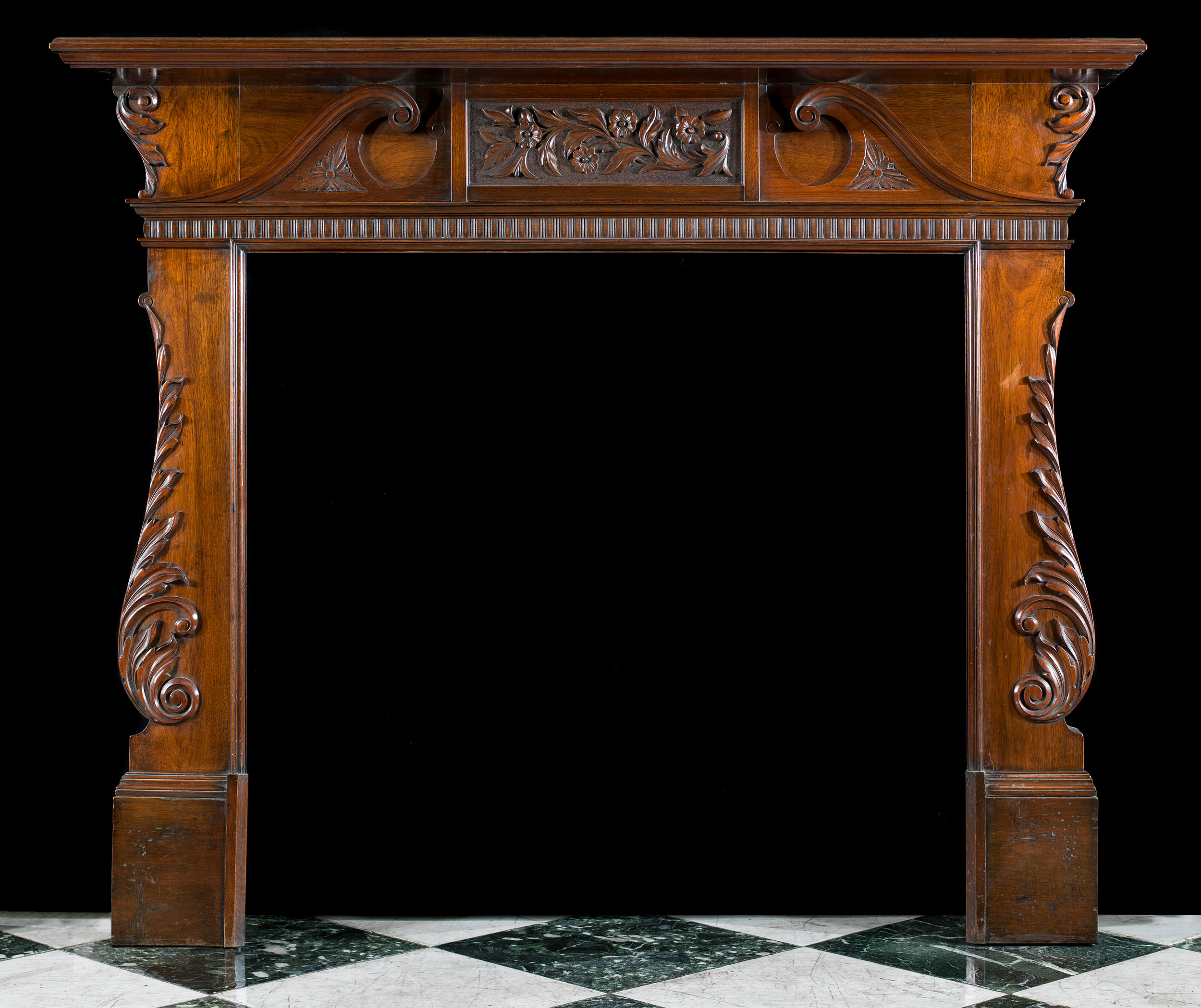 A Walnut Palladian Style Fireplace Mantel
