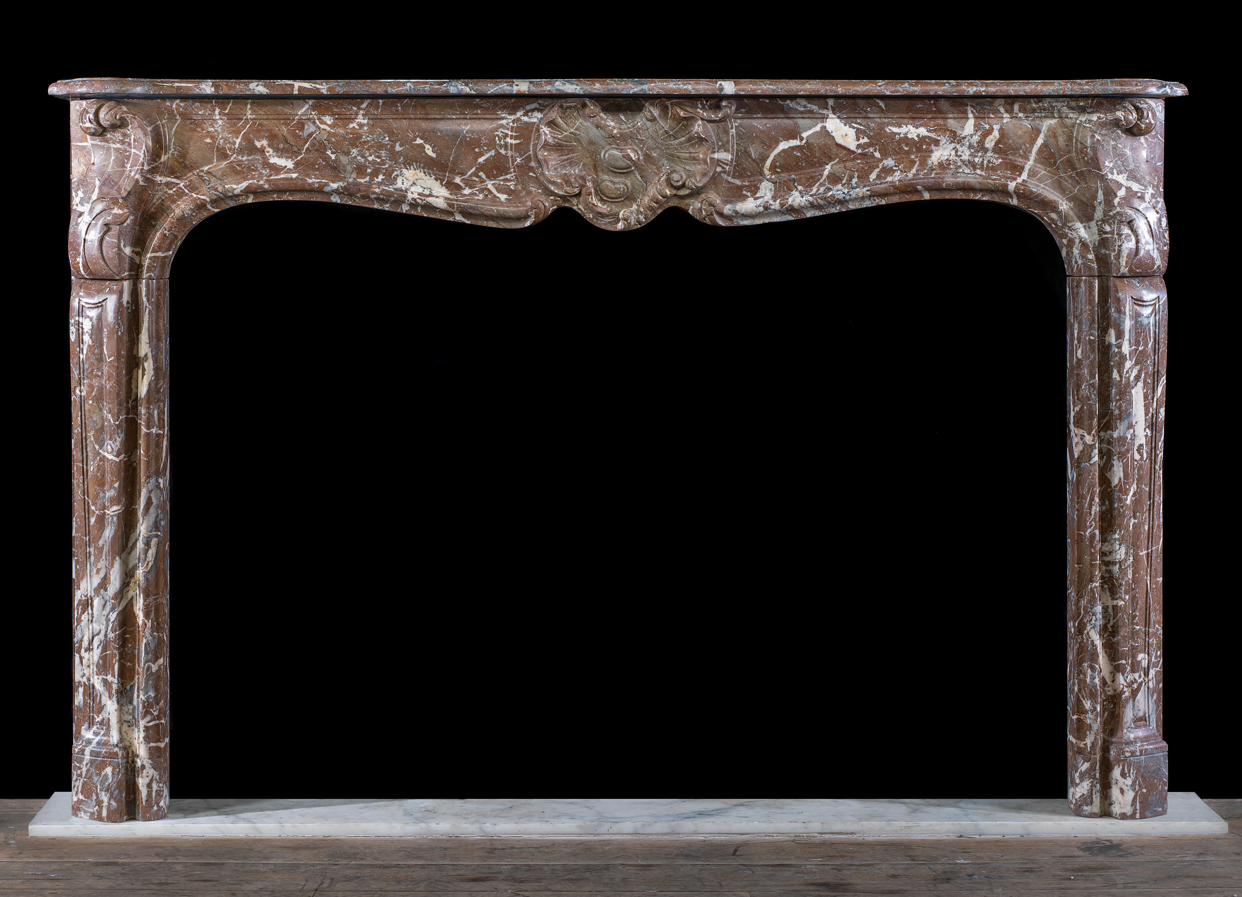 A Rouge Marble Louis XV Chimneypiece
