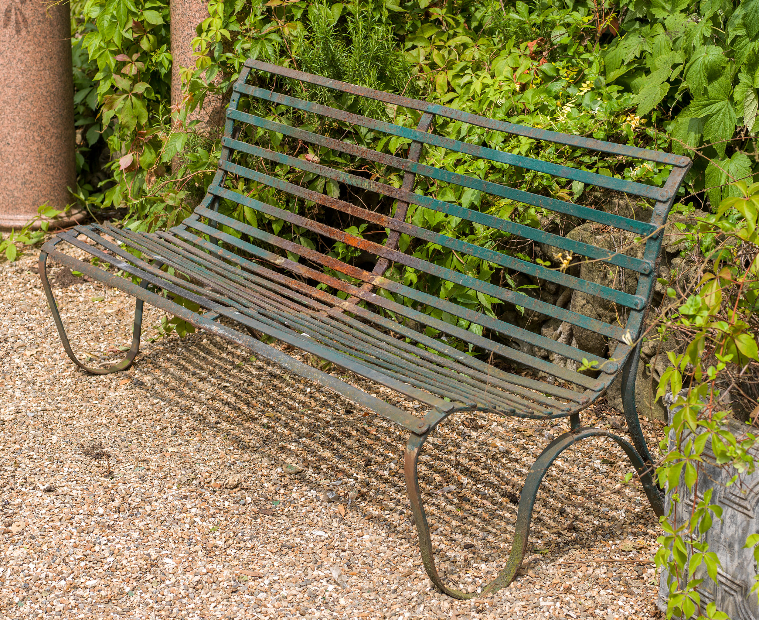 A Victorian wrought iron garden bench

