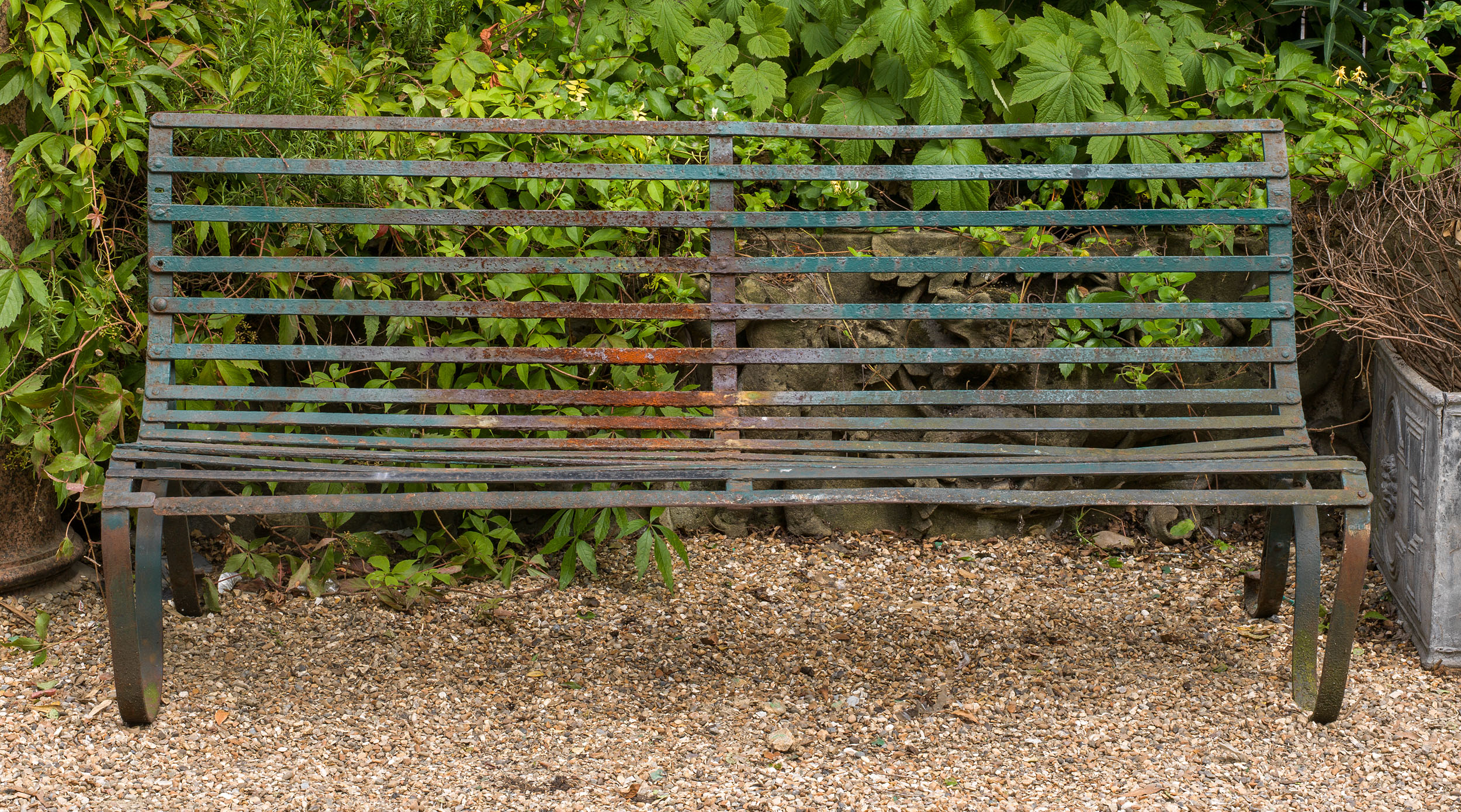A Victorian wrought iron garden bench

