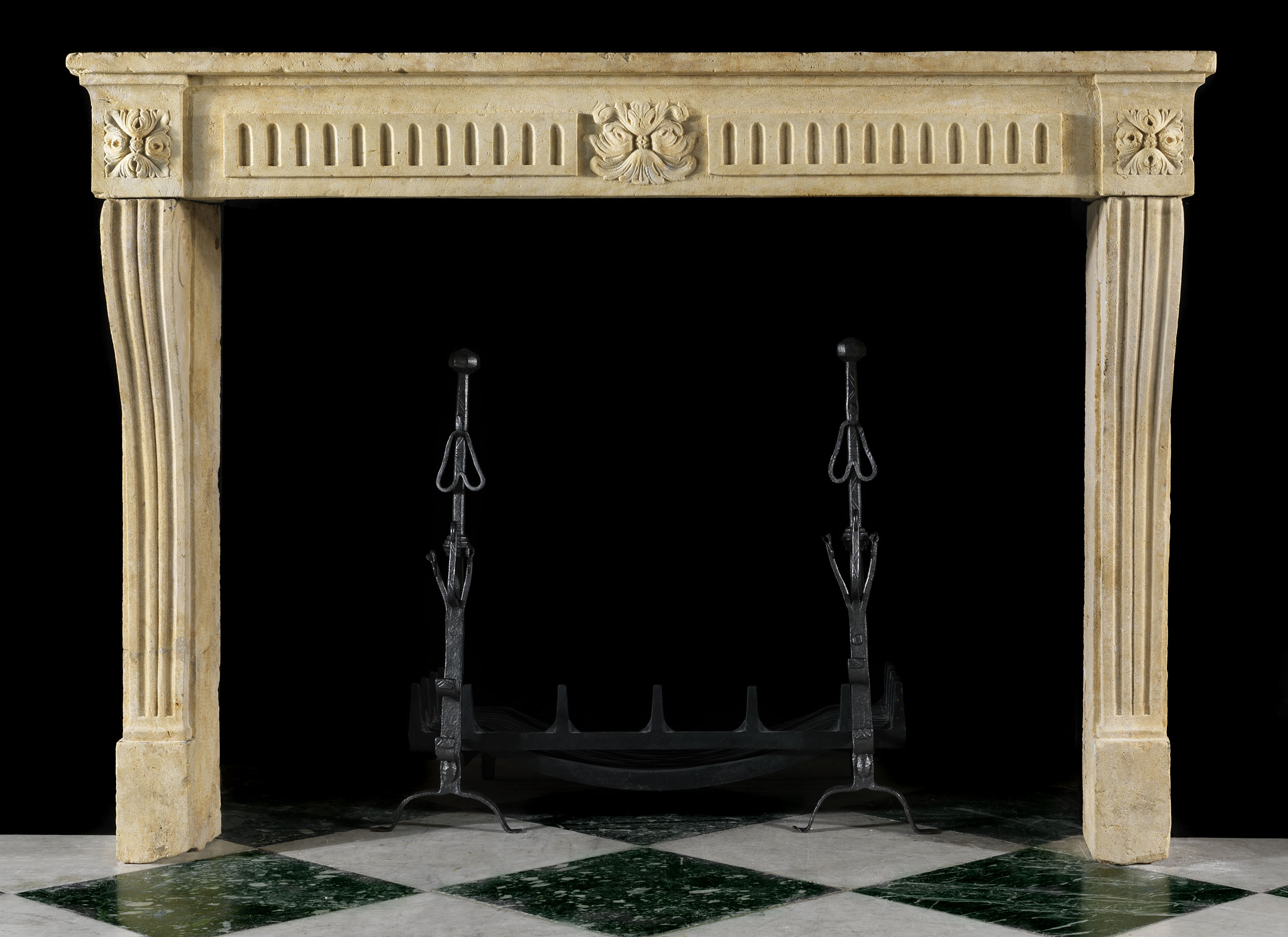 A Louis XVI Limestone Fireplace Surround
