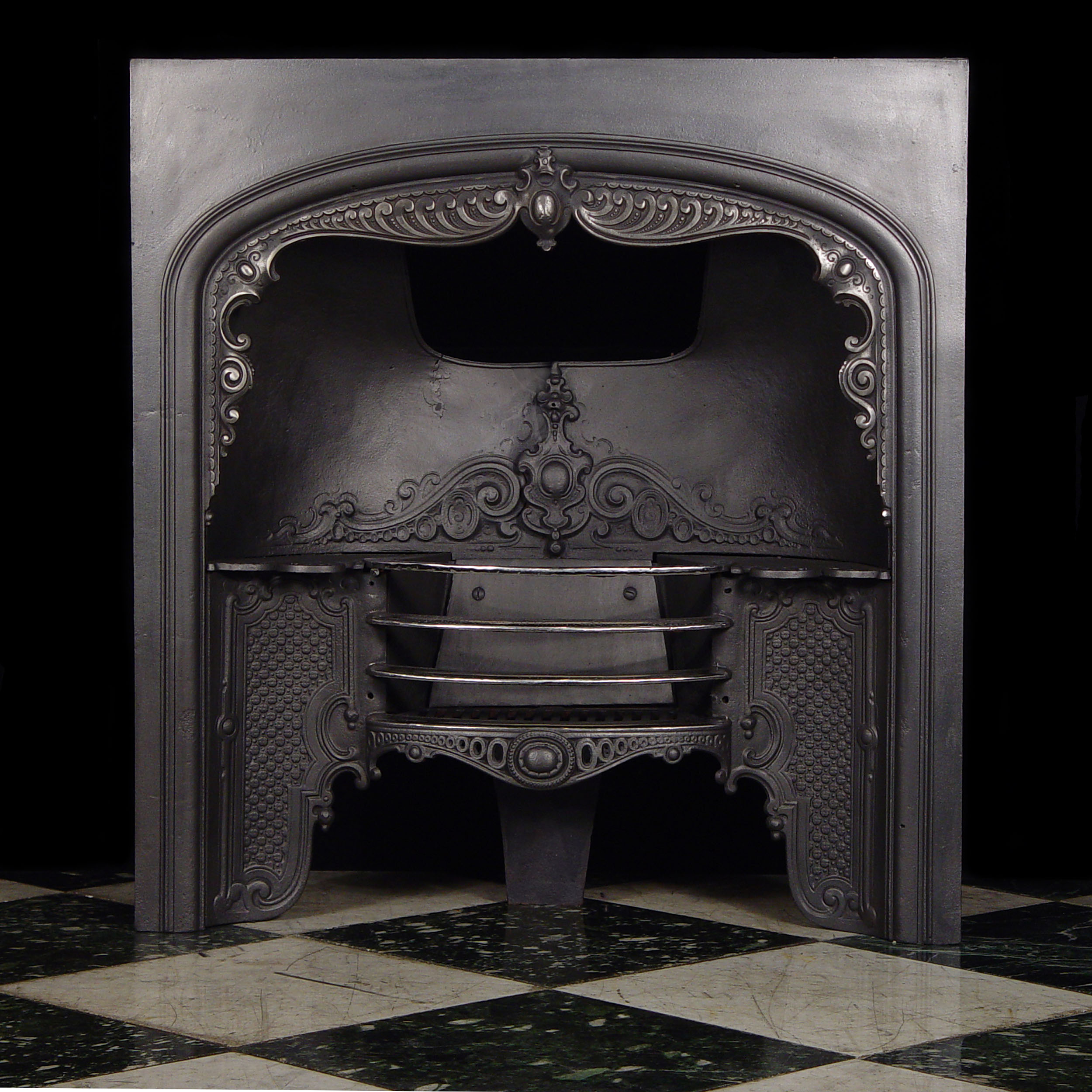 An Antique Cast Iron Fireplace Insert

