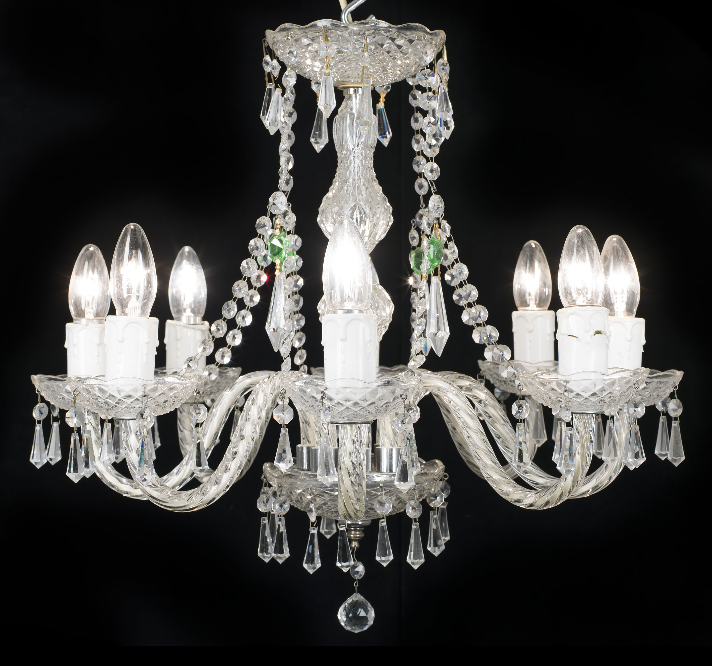 An eight branch 20th century cut and moulded glass chandelier    