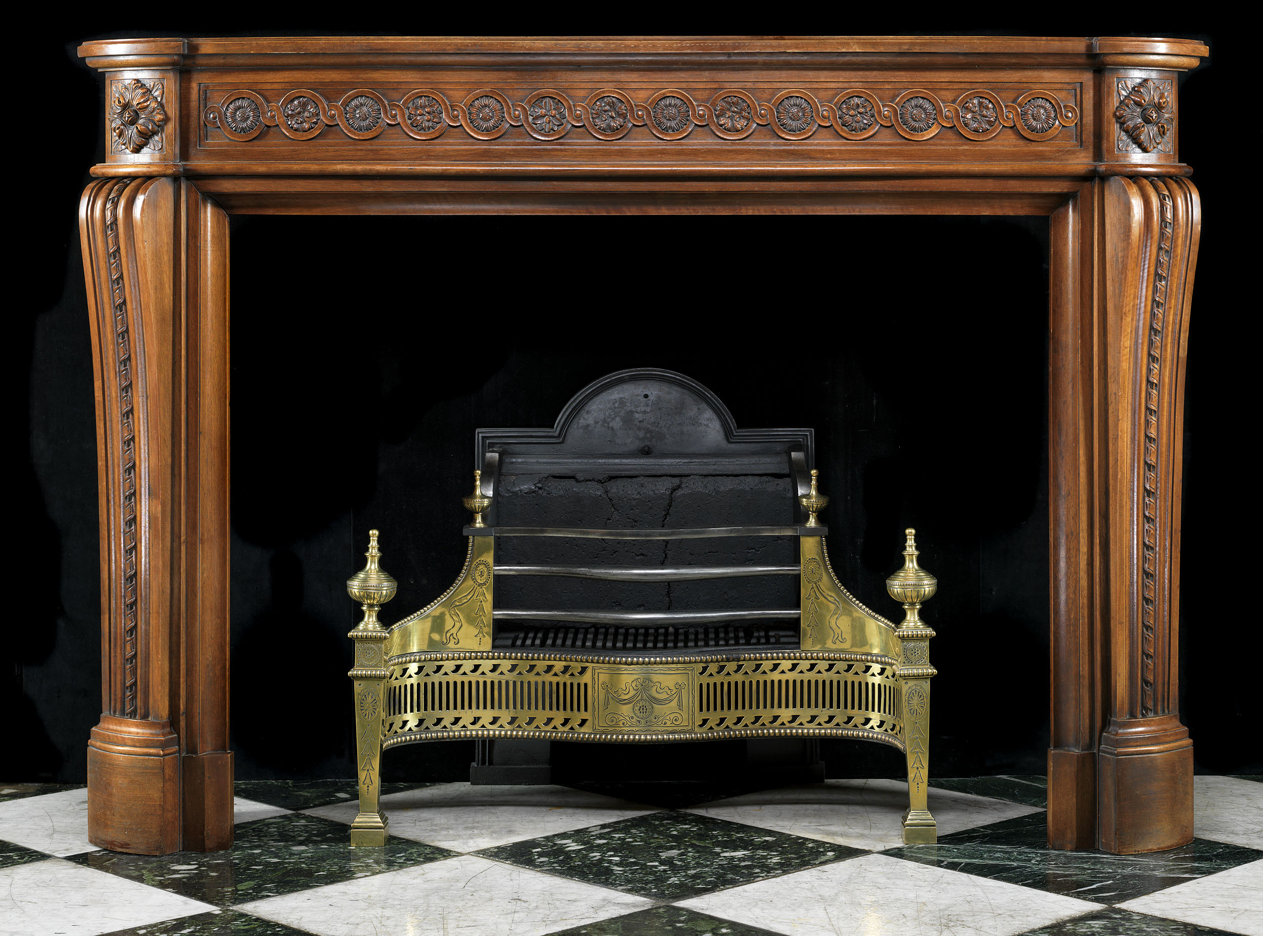 A Louis XVI Carved Walnut Fireplace Mantel
