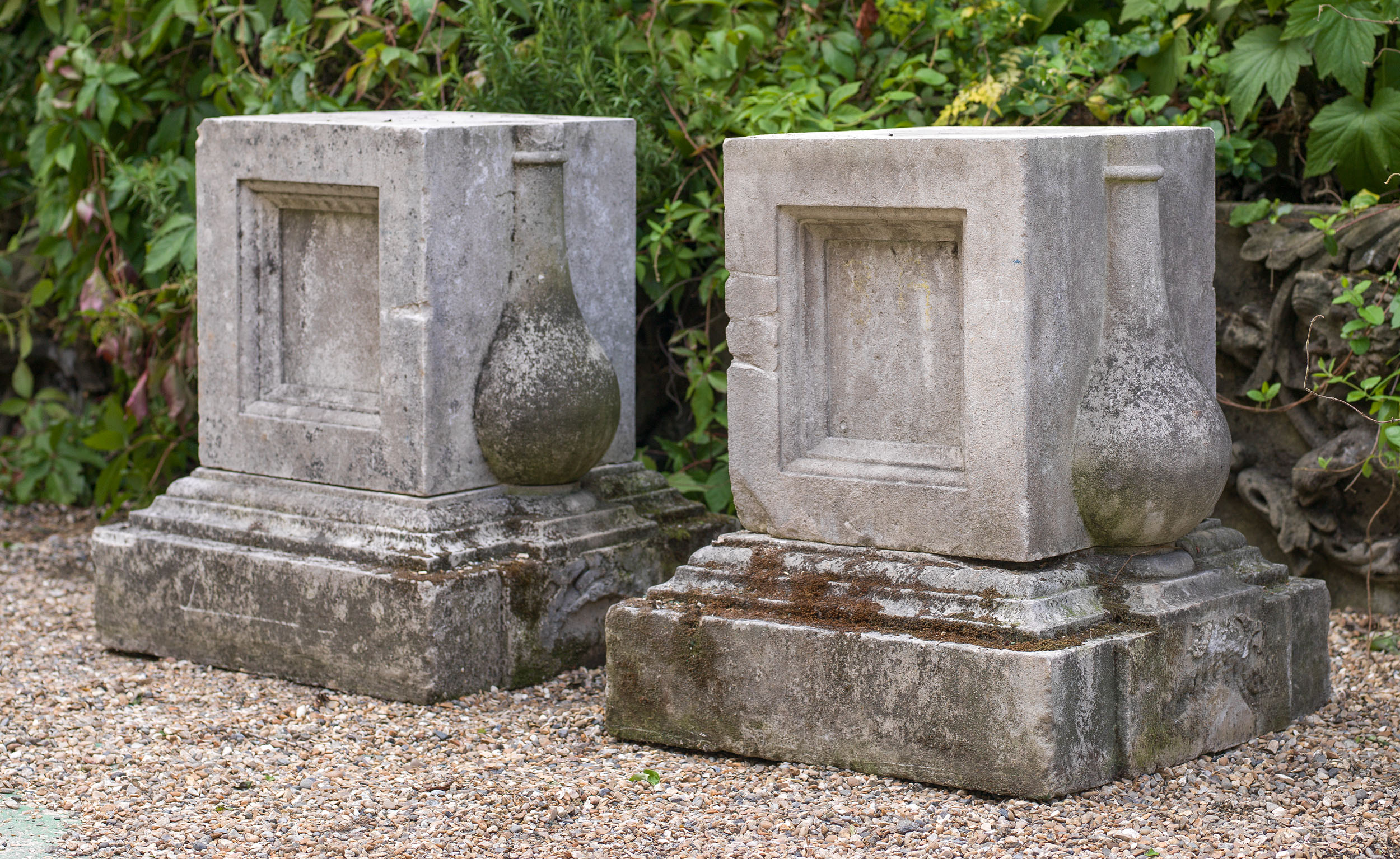 A pair of Portland Stone garden plinths

