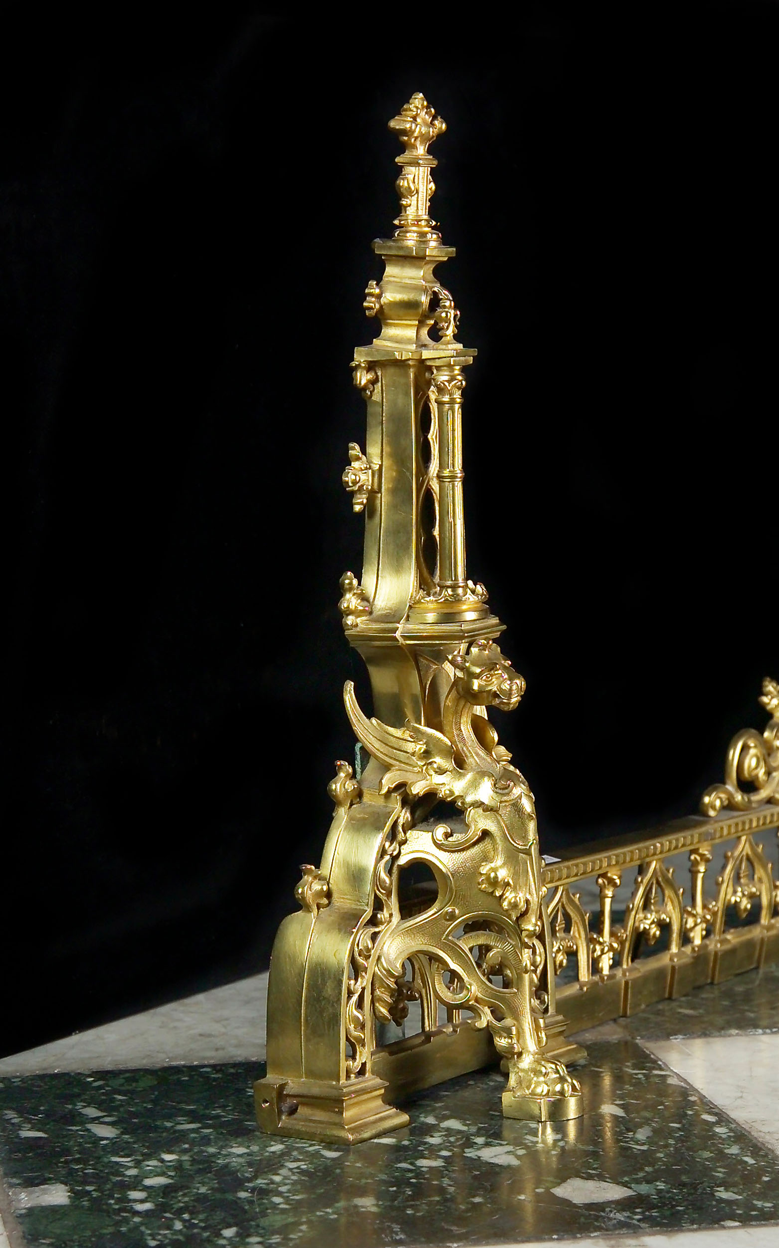 An Antique Heraldic Brass Chenets Fender