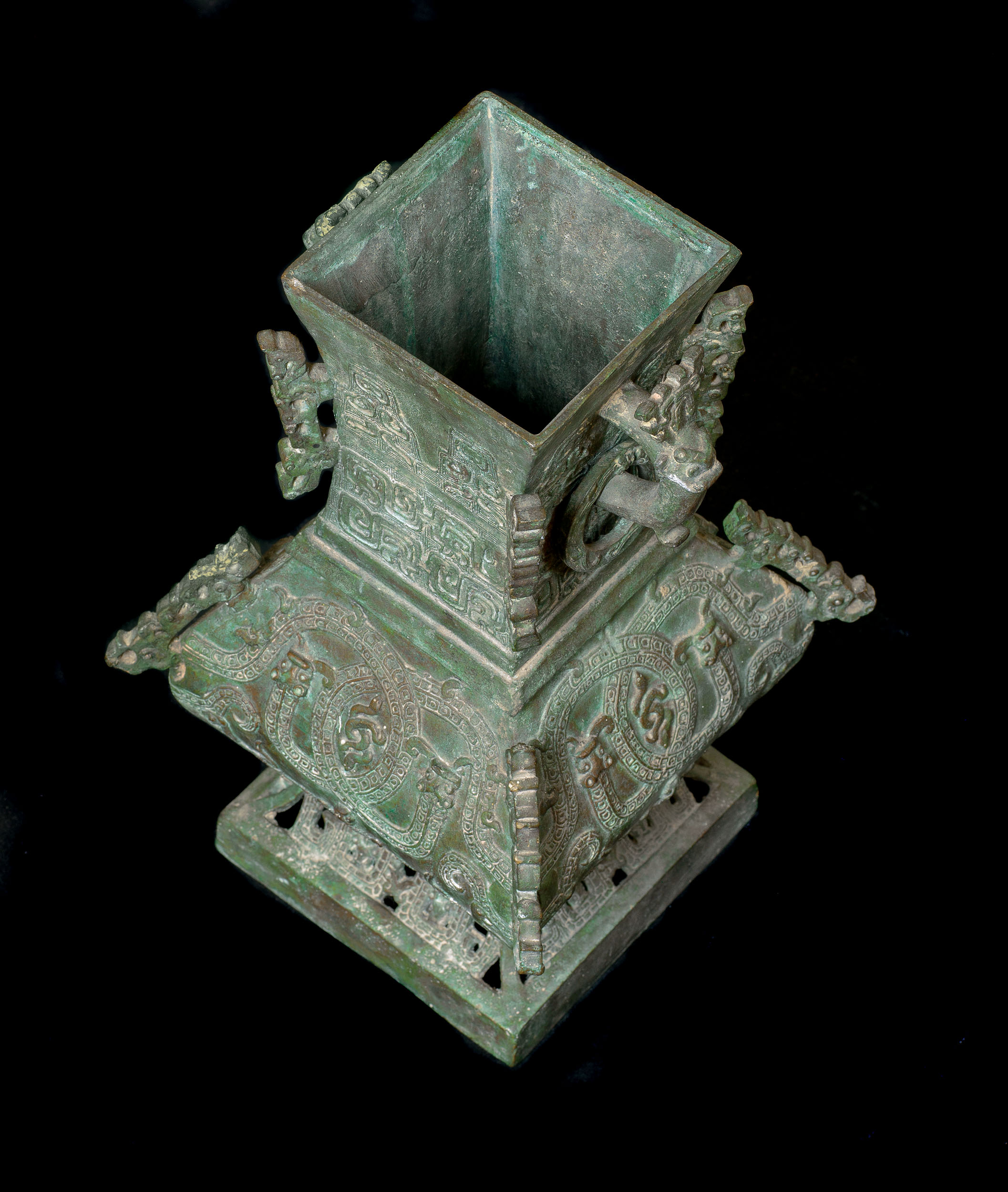 A small Shang Dynasty style bronze vase