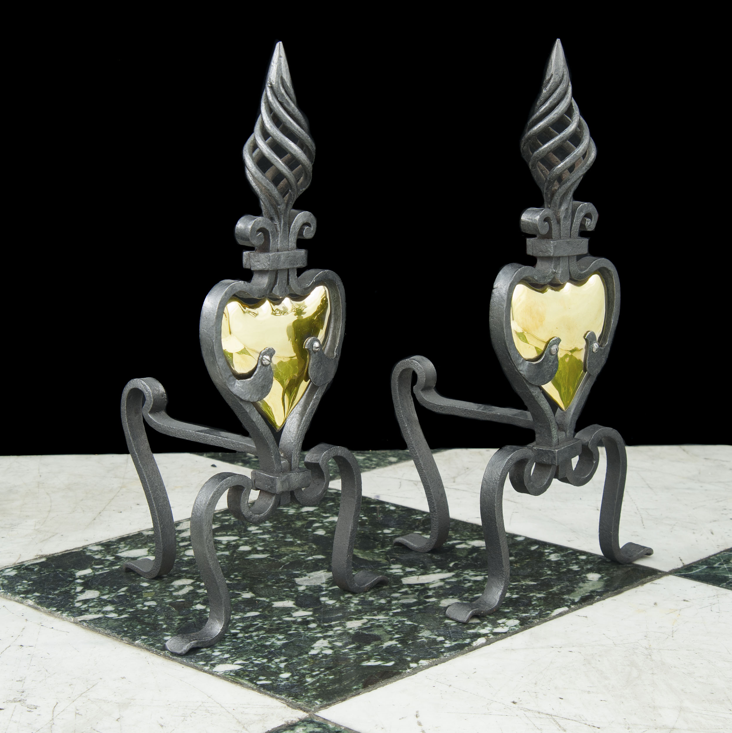 A Pair of Art Nouveau Wrought Iron Fire Dogs