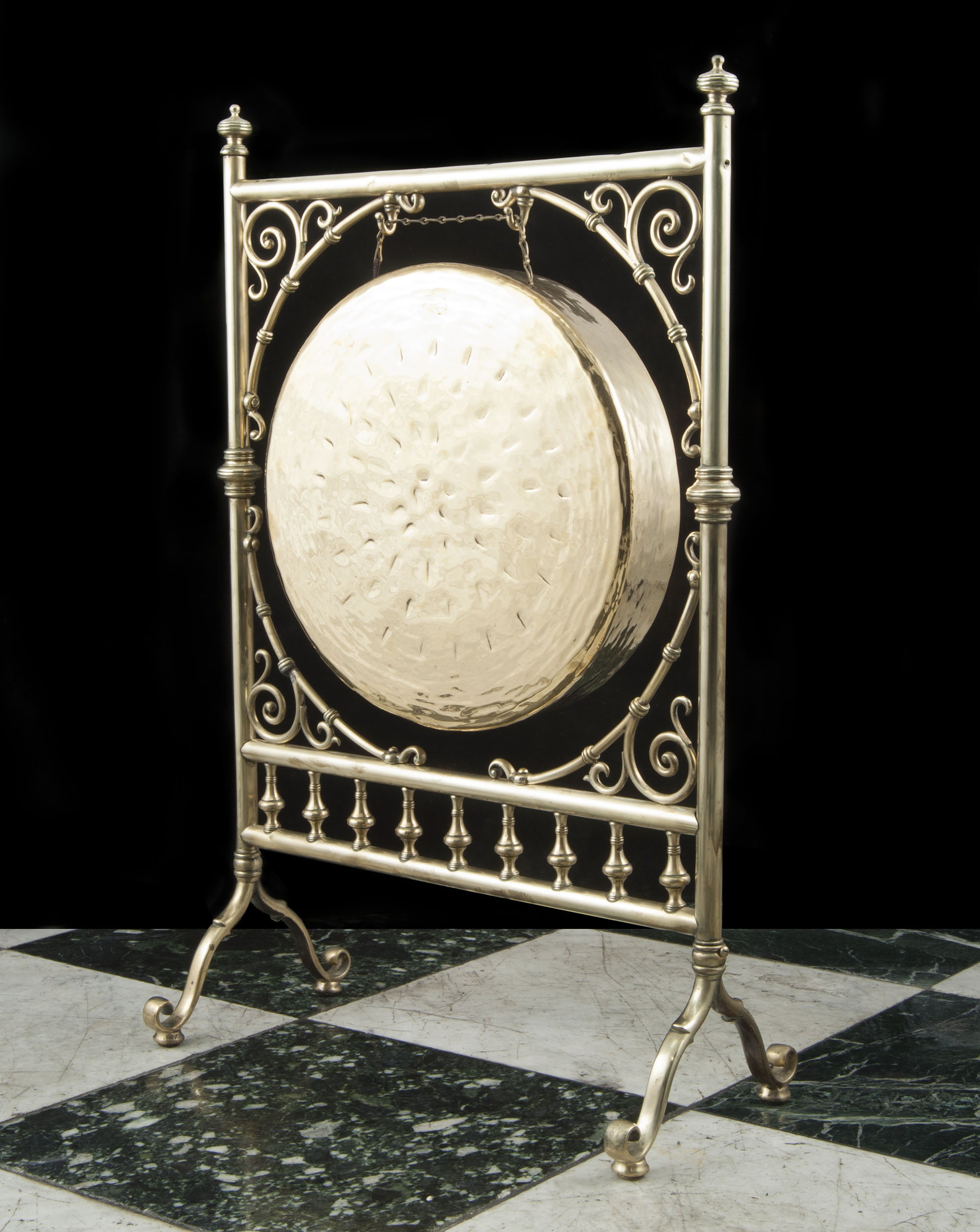 A Victorian brass dinner gong
