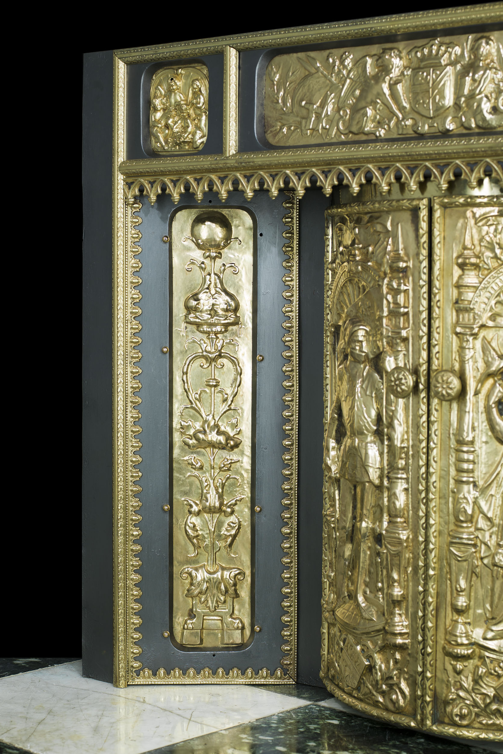 An Embossed Brass French Fireplace Insert