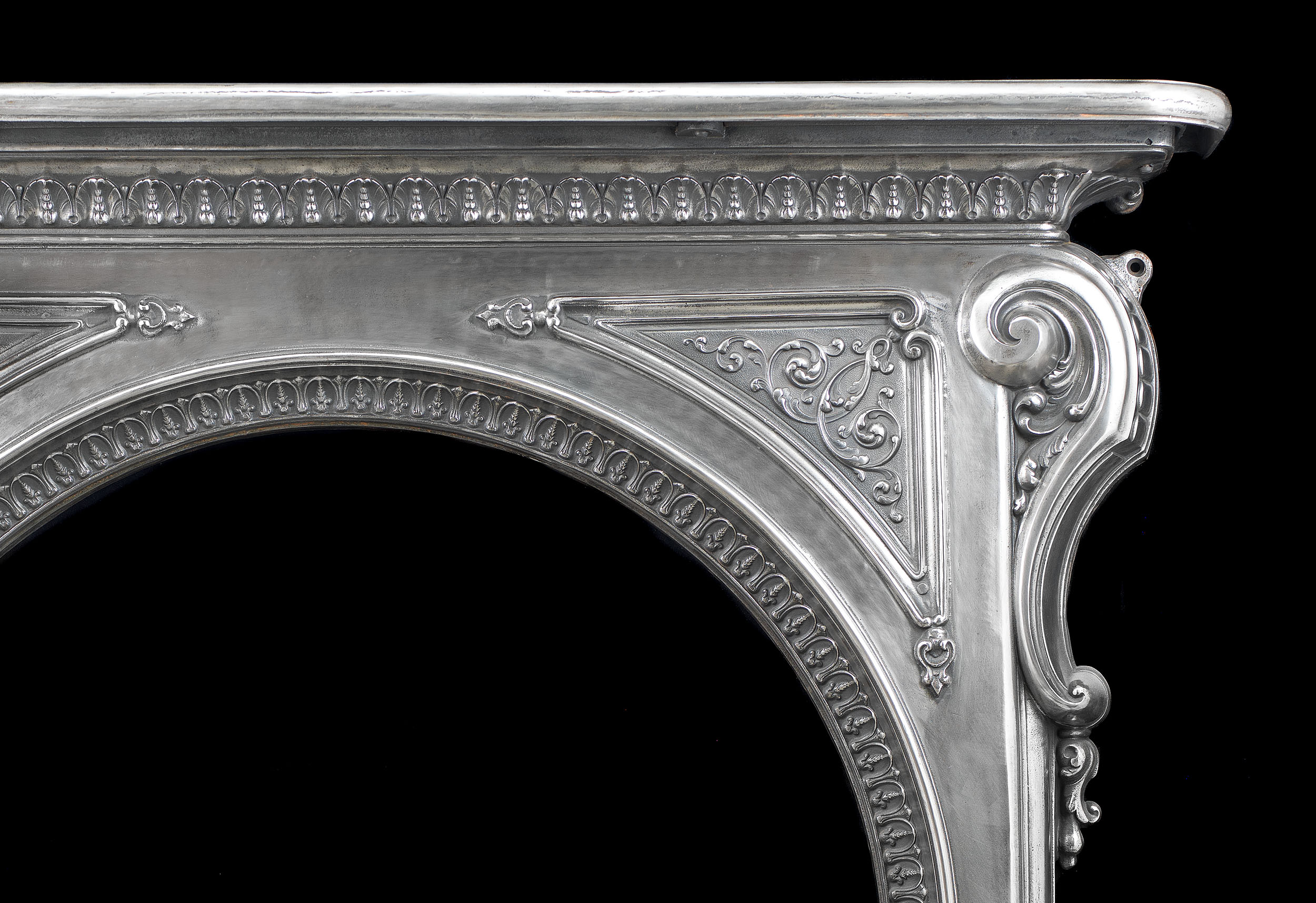 A Cast Iron Rococo Style Fireplace Mantel