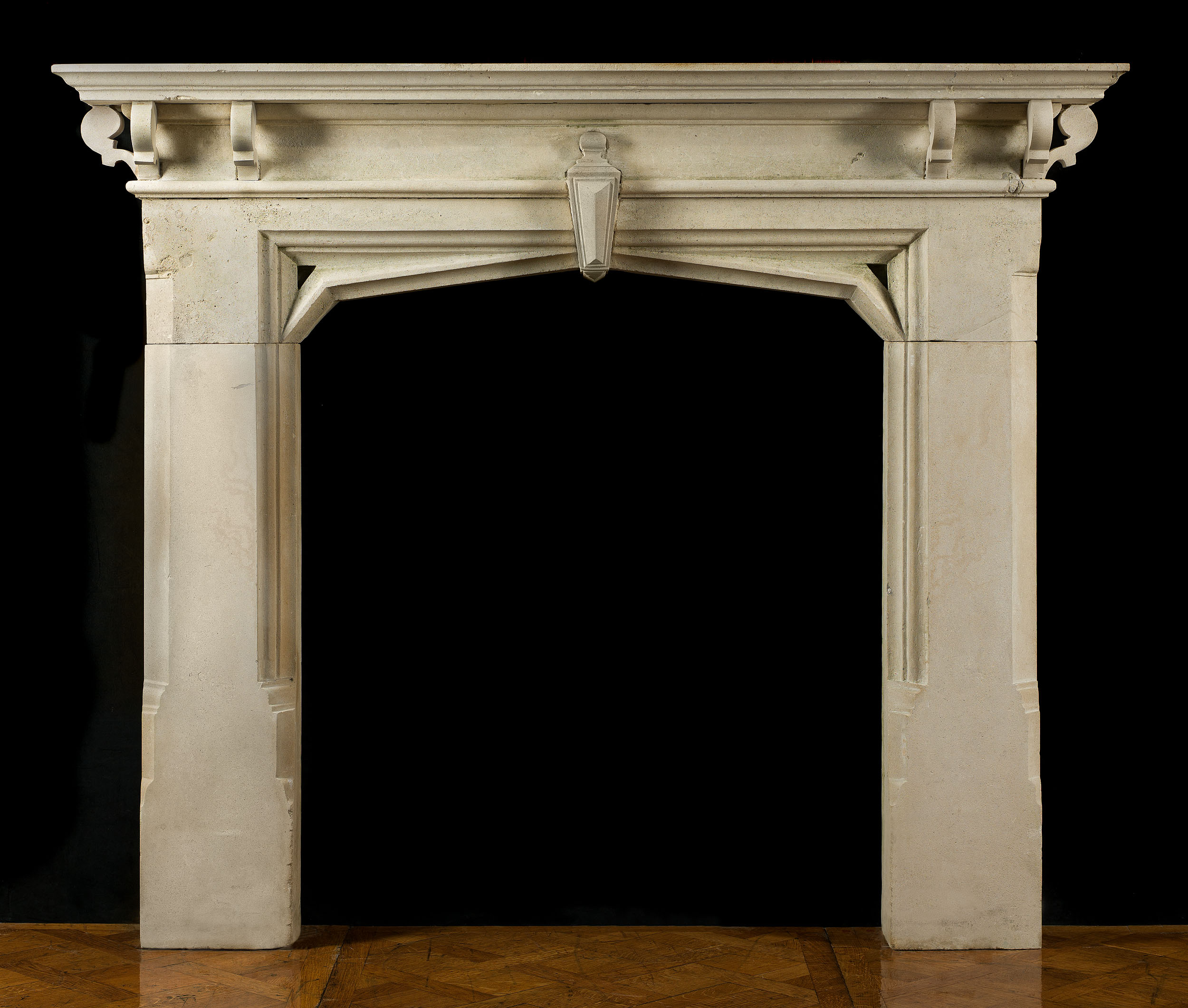 A Limestone Gothic Revival Antique Fireplace