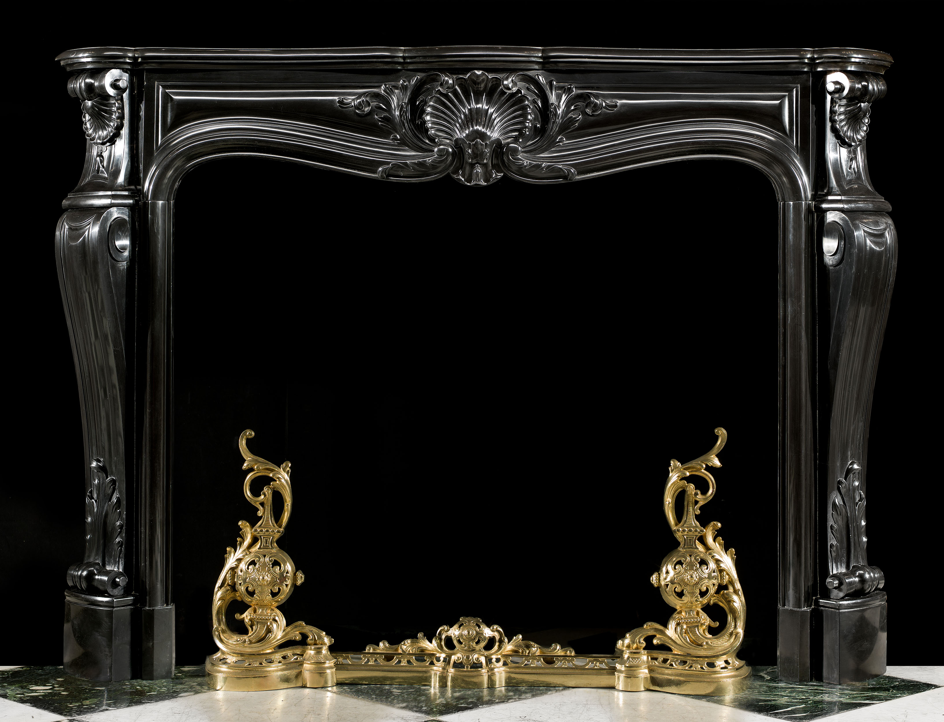 An elegant Belgian Black Marble French Louis XV style Rococo antique chimneypiece.