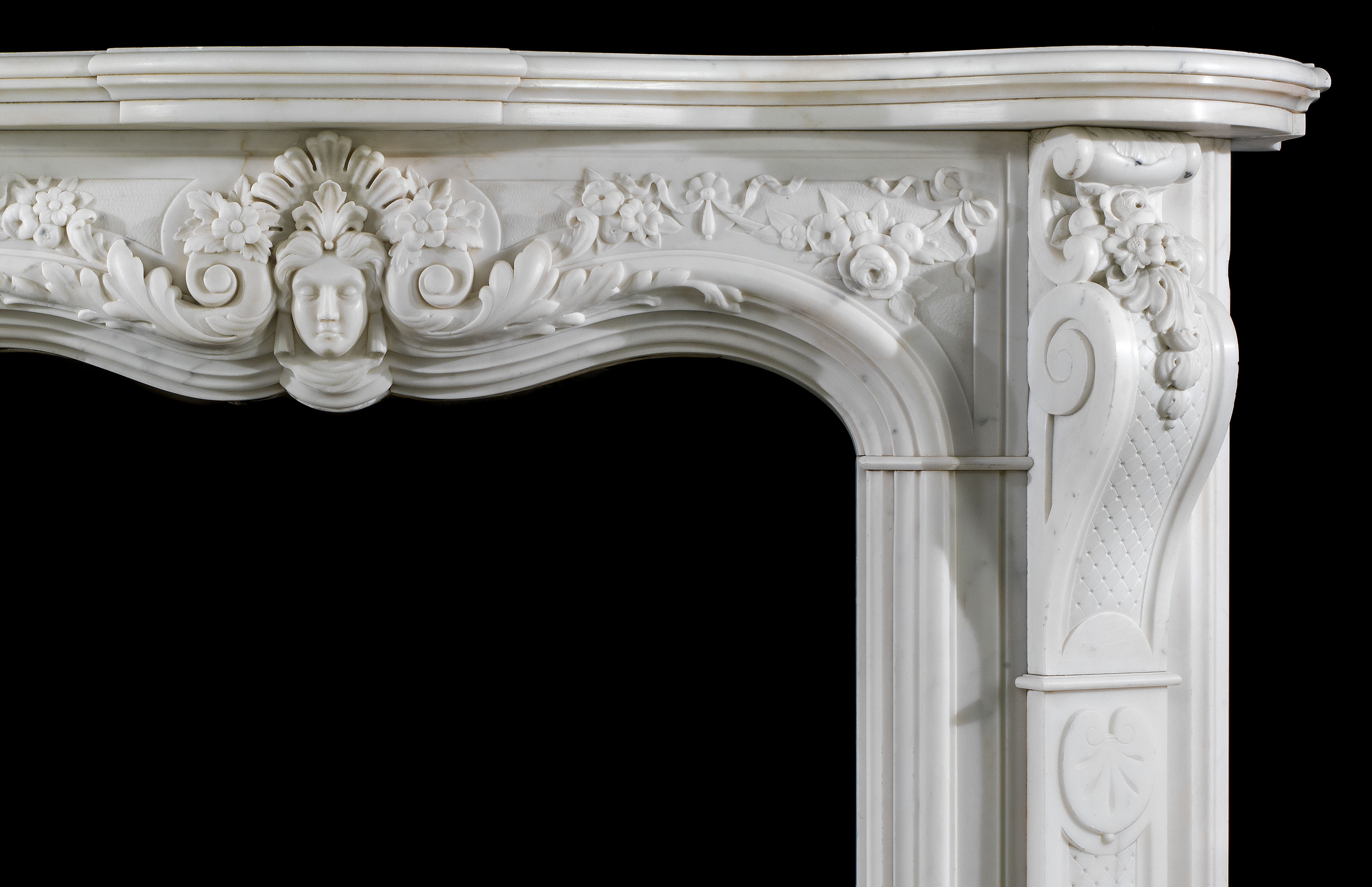 An antique Statuary Marble Rococo style fireplace surround