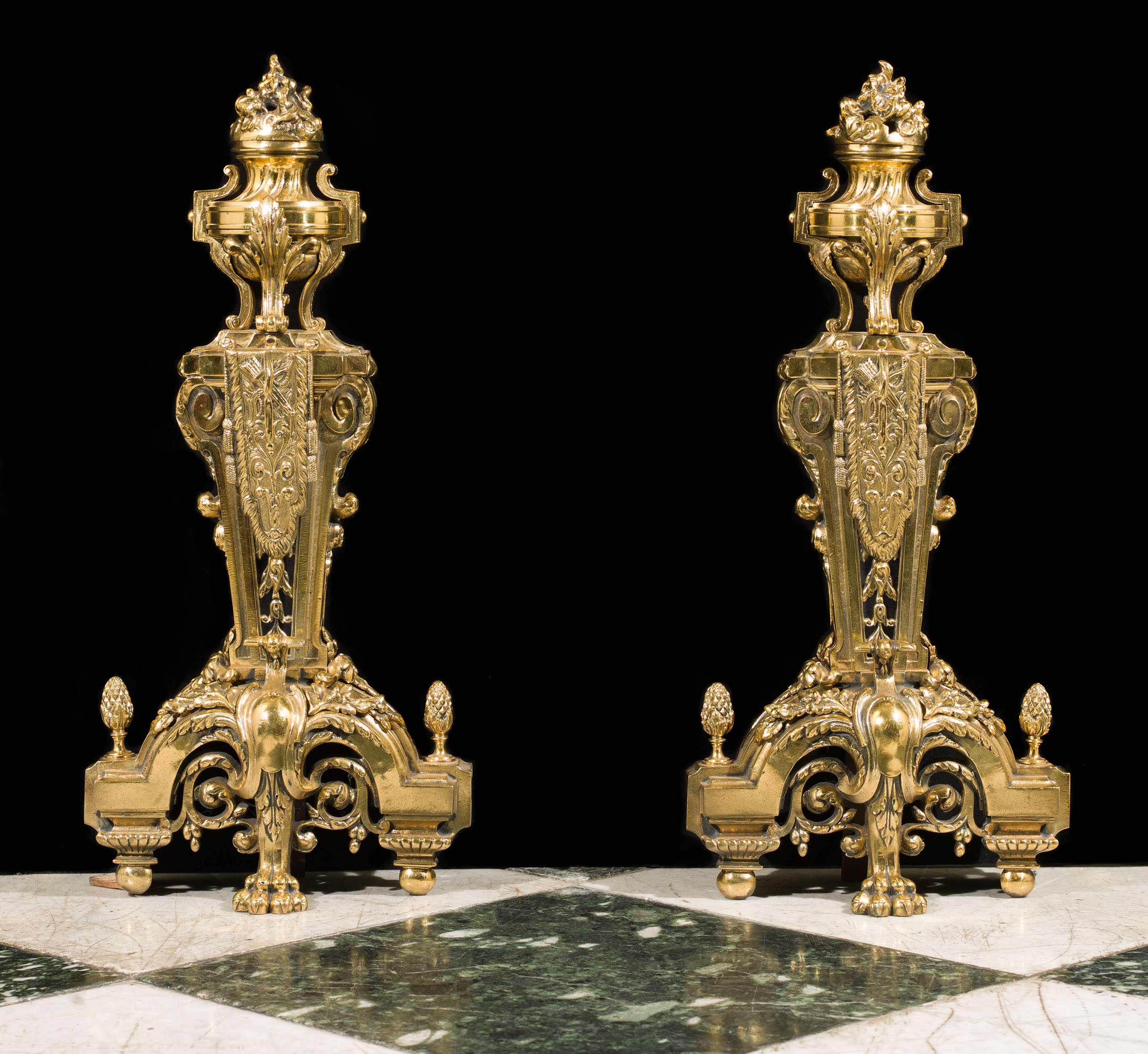  A pair of large brass Louis XVIstyle antique chenets.  