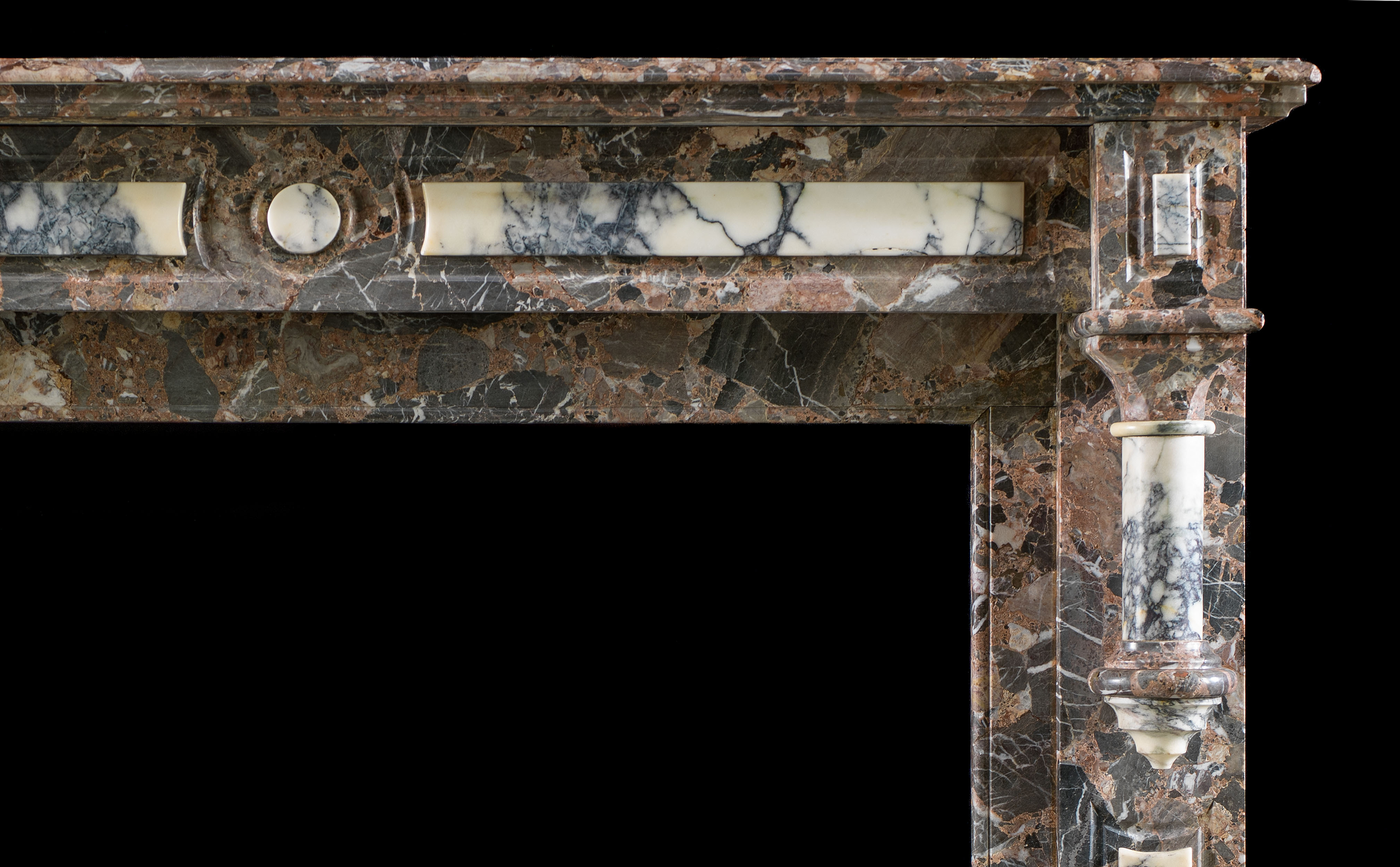 An antique Gothic Revival marble fireplace surround    
