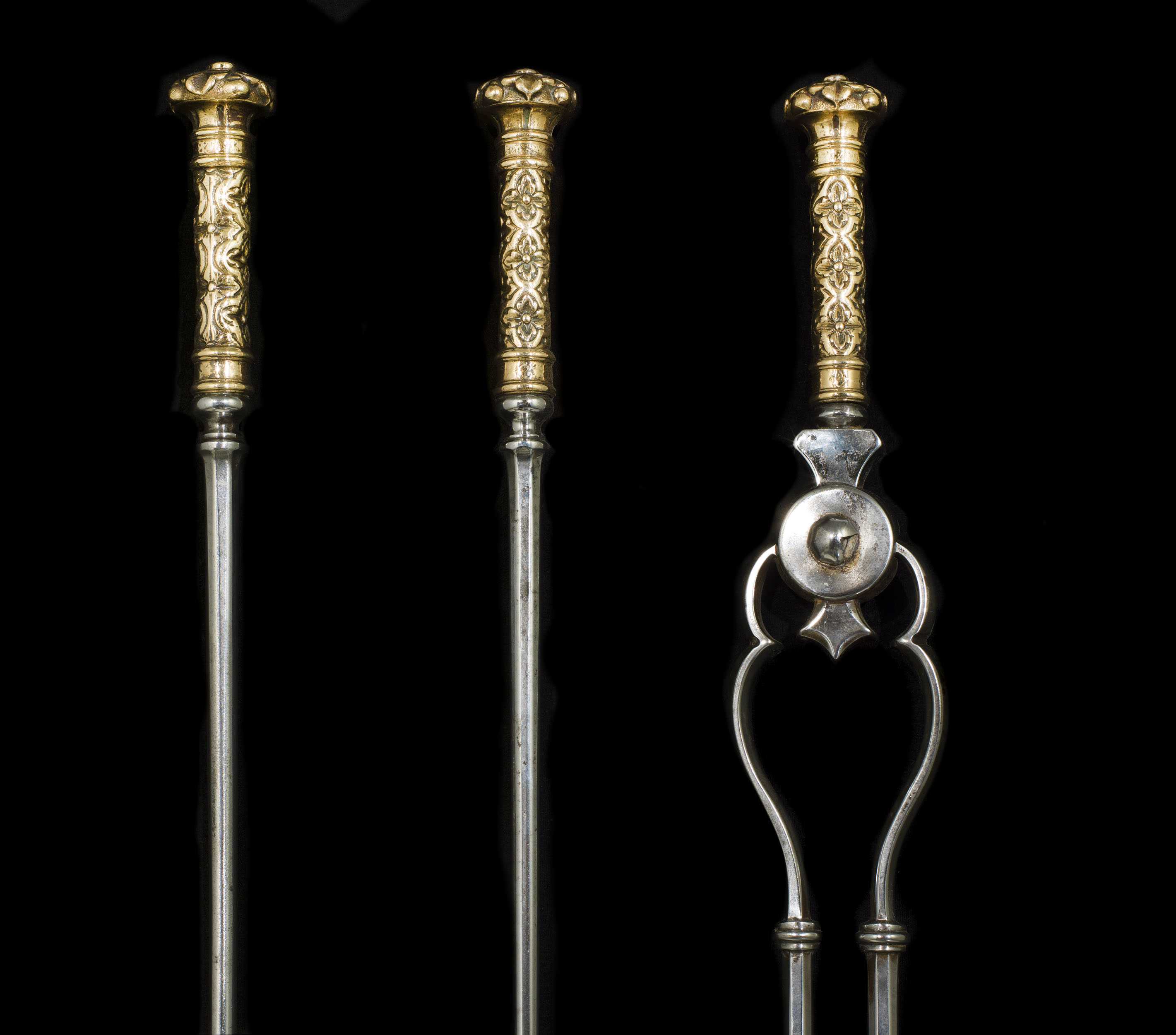 A set of three Georgian style steel & brass firetools 