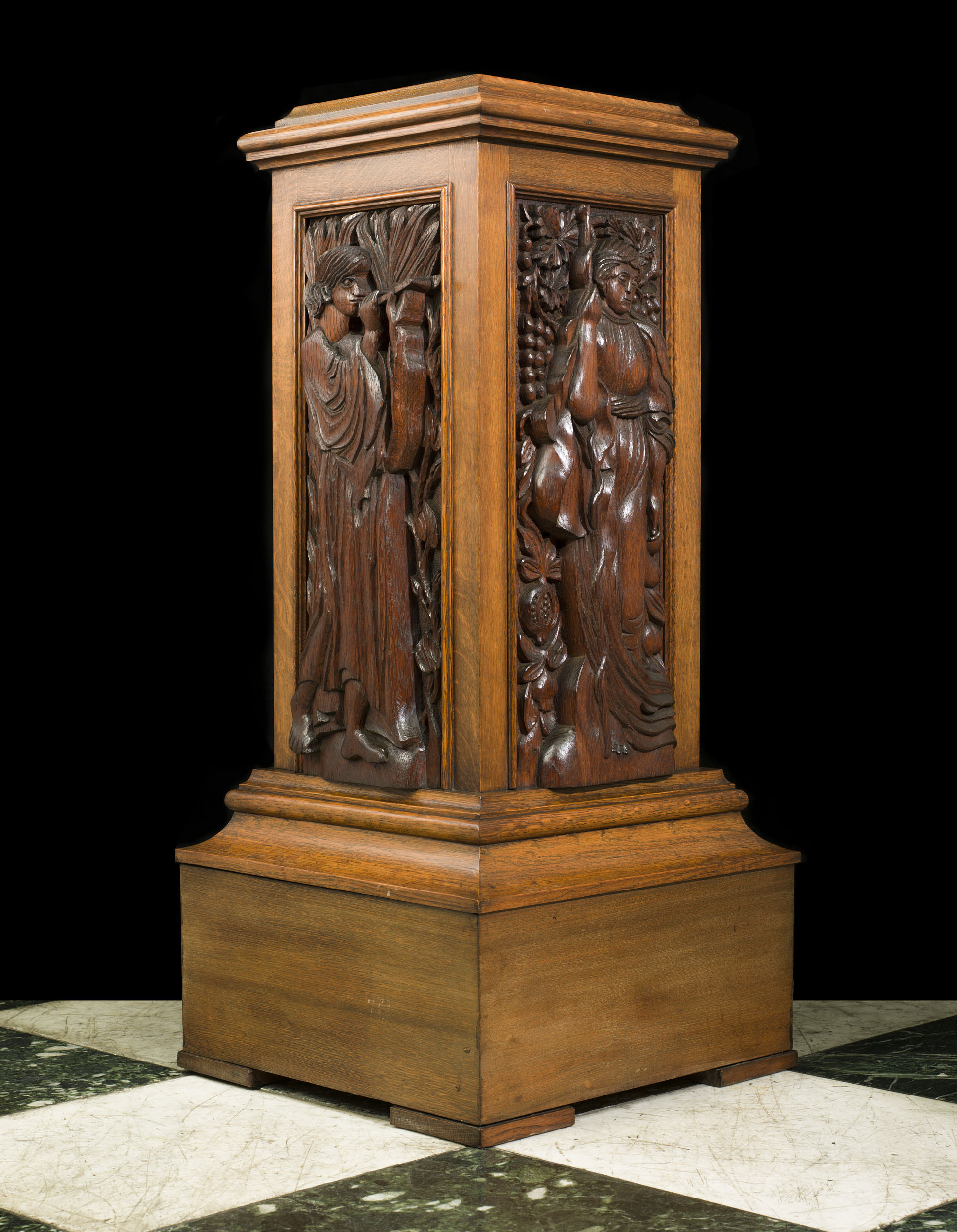 An Arts and Crafts Carved Oak Pedestal