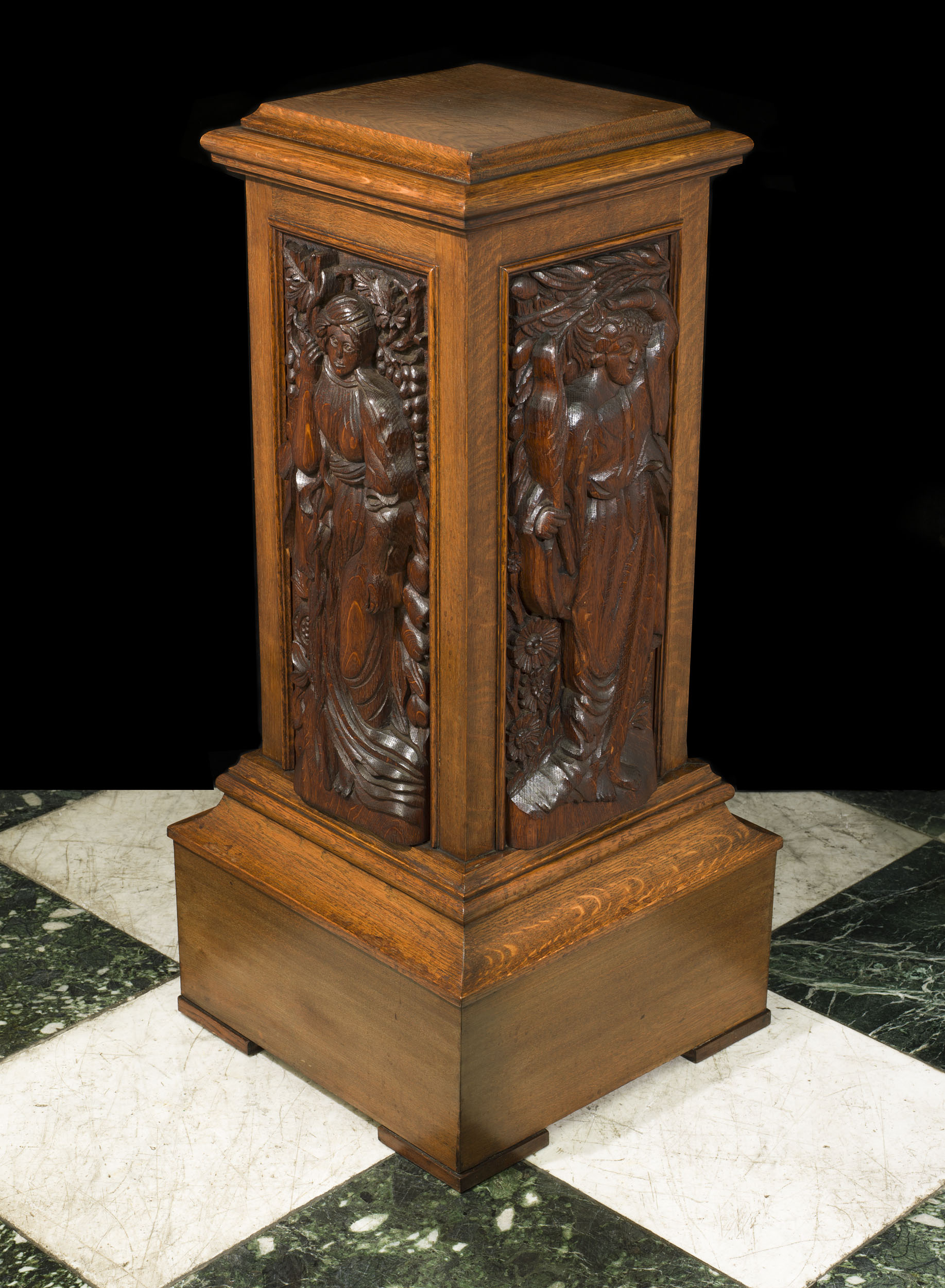 An Arts and Crafts Carved Oak Pedestal