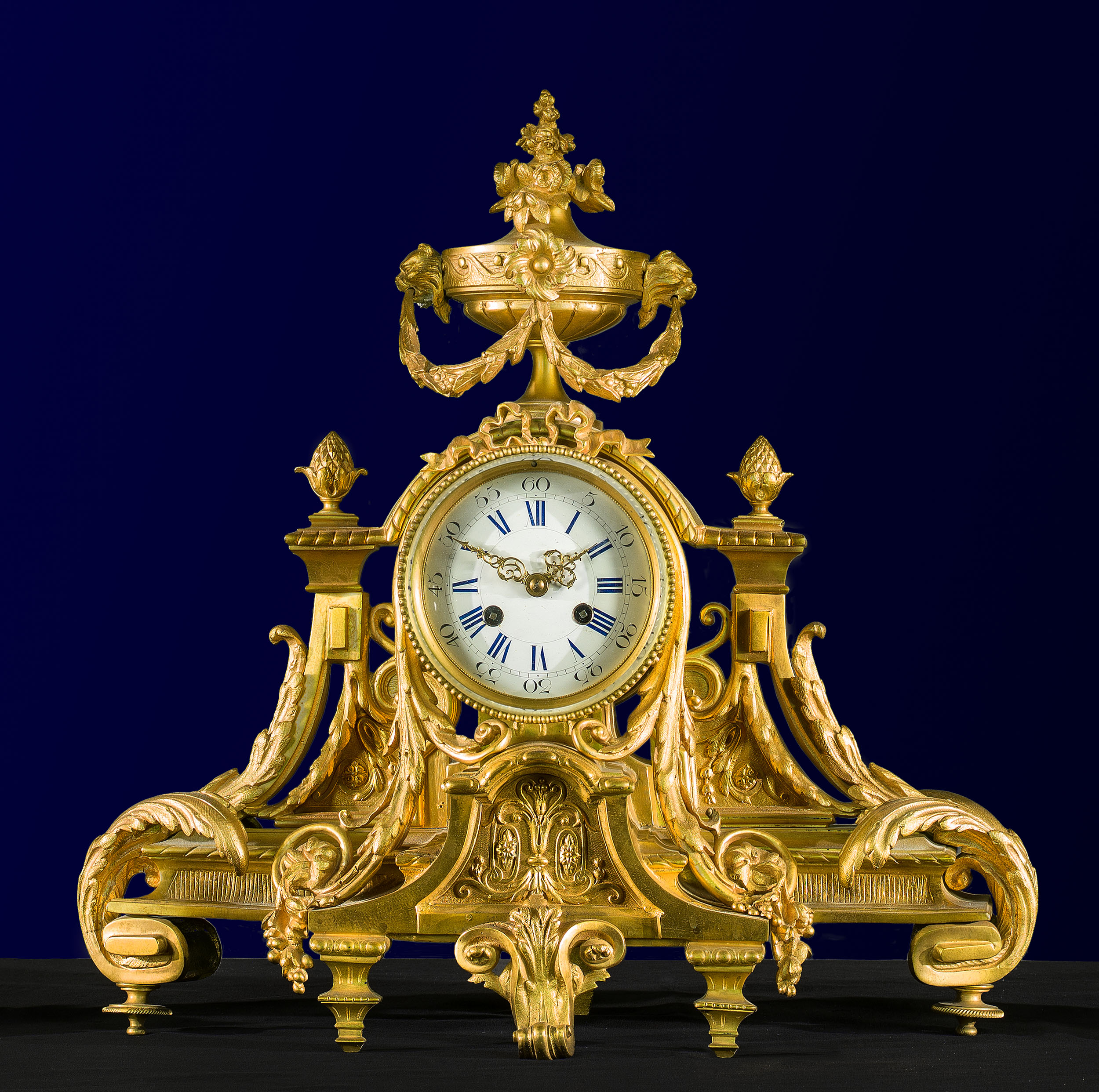 A  Gilt Bronze Rococo Style Clock Garniture