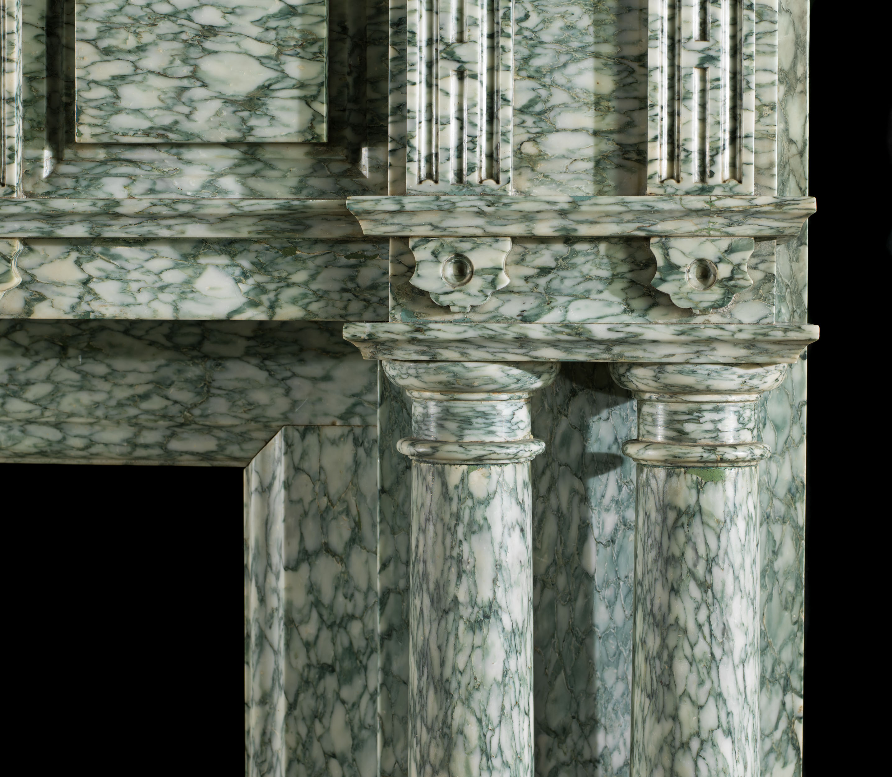 A substantial, columned antique chimneypiece in the Palladian style