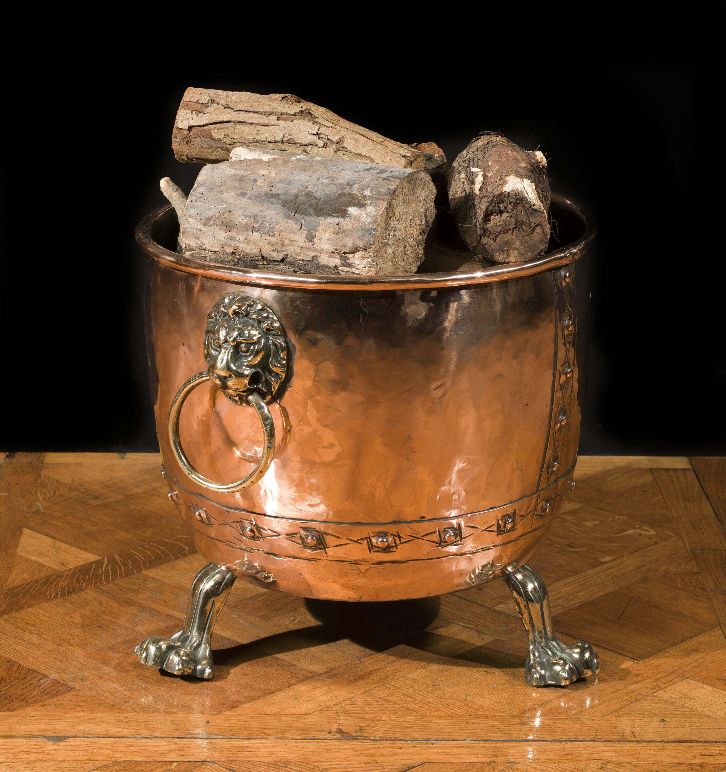 An antique Victorian lion mask copper log bin     
