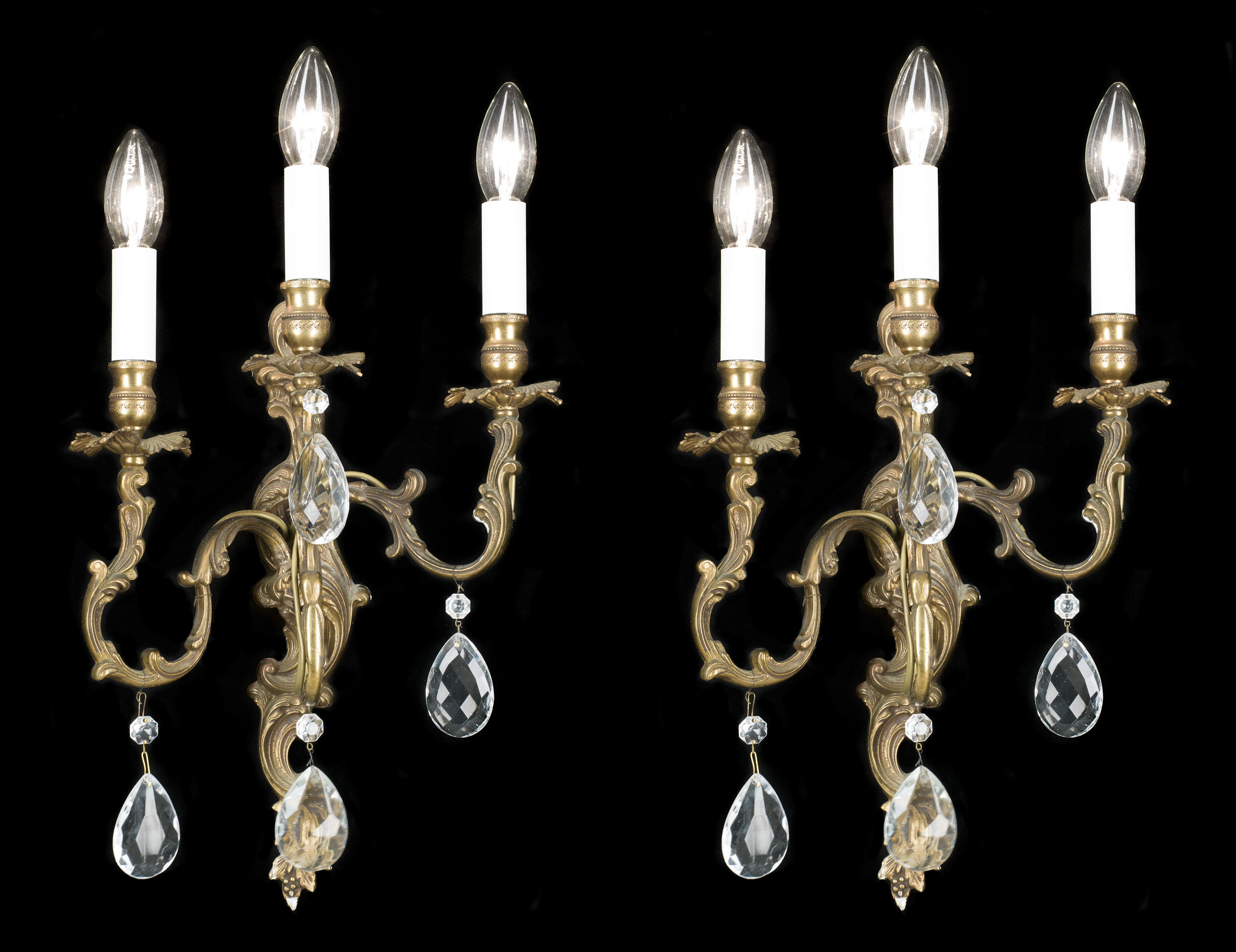 A 20th century set of four gilt brass wall lights    