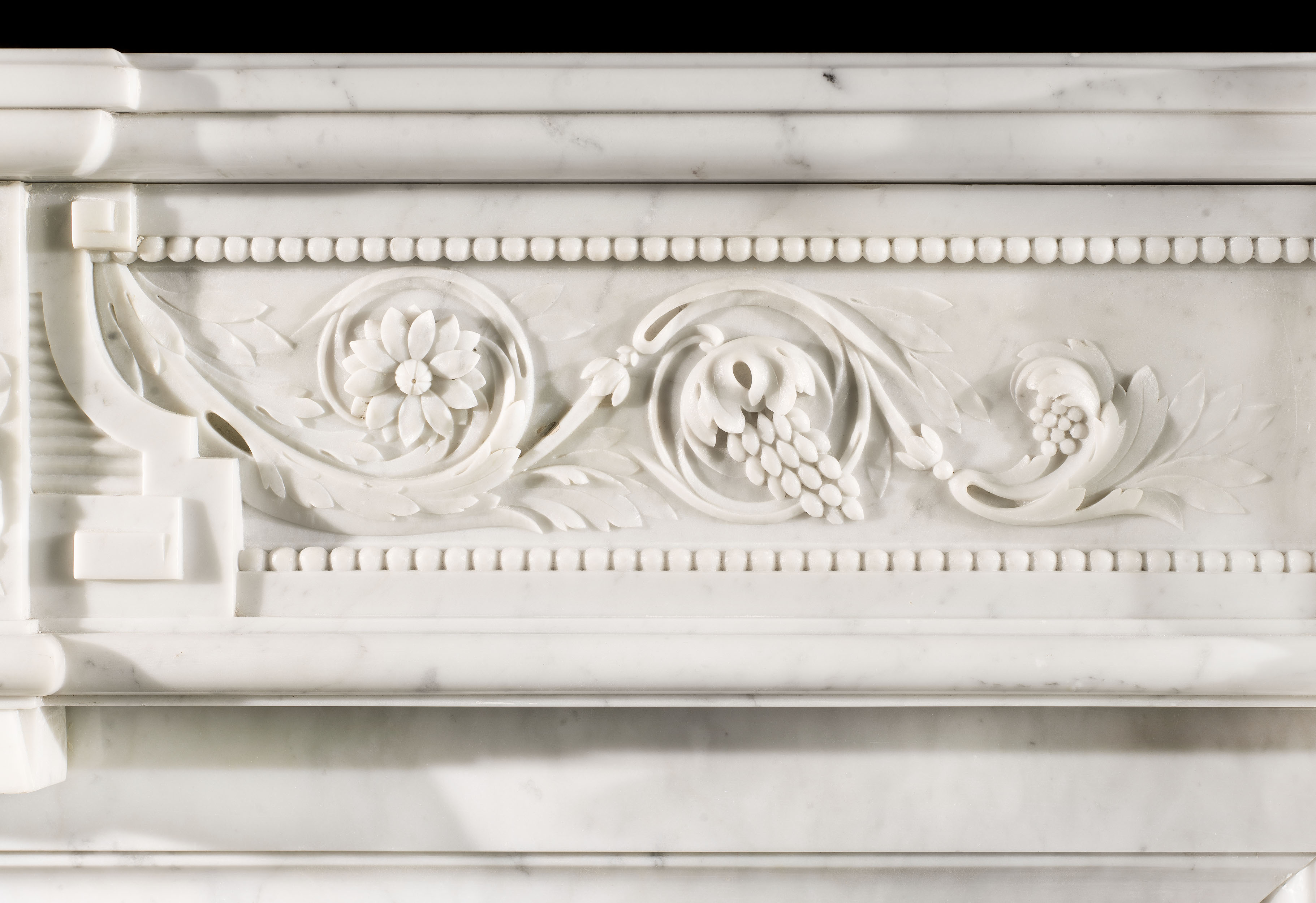A Louis XVI Style Carrara Marble Fireplace 