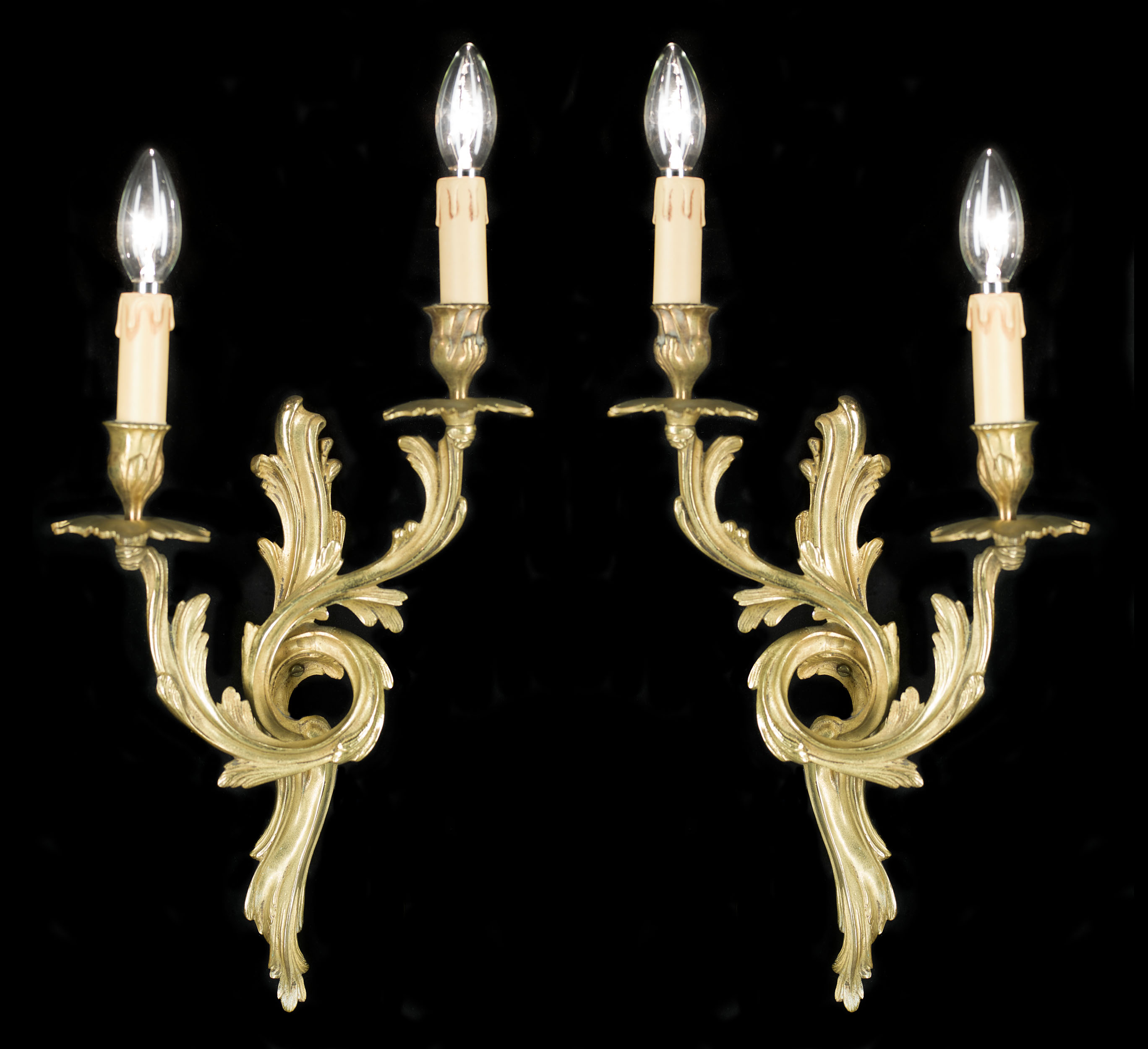  A 20th century pair of Rococo style wall lights   