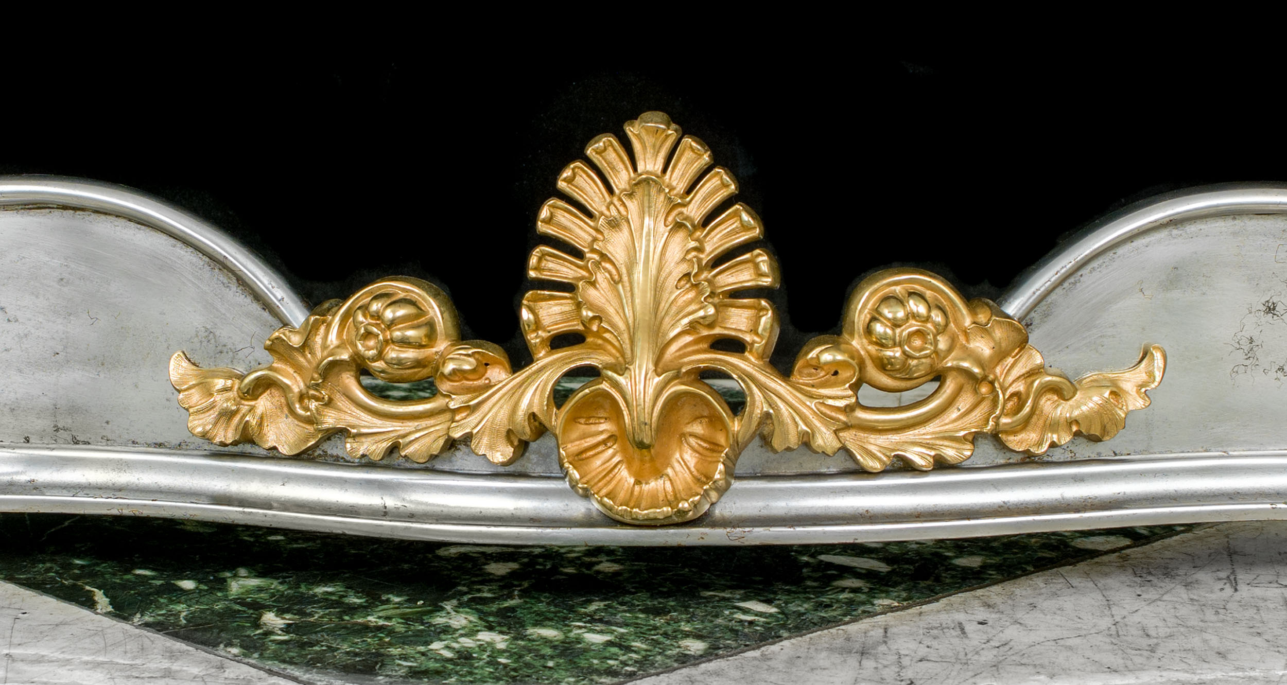 A steel and brass mounted Victorian serpentine fireplace fender.