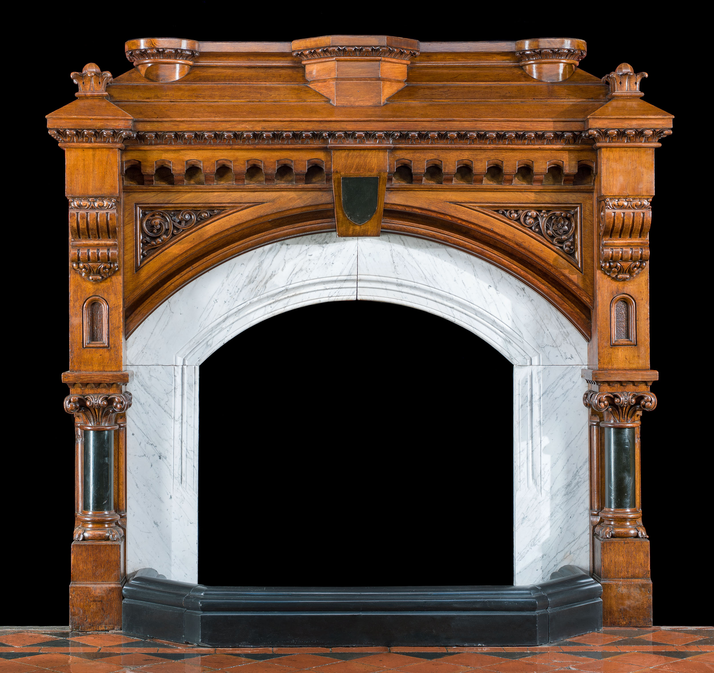 A Tall Gothic Revival Antique Oak Fireplace