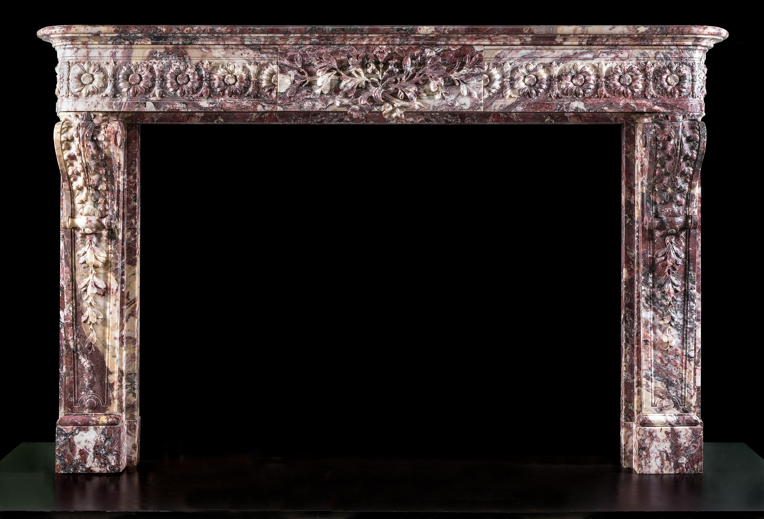A beautiful antique Louis XVI Fleur de Pecher Cheminee Fireplace Surround
