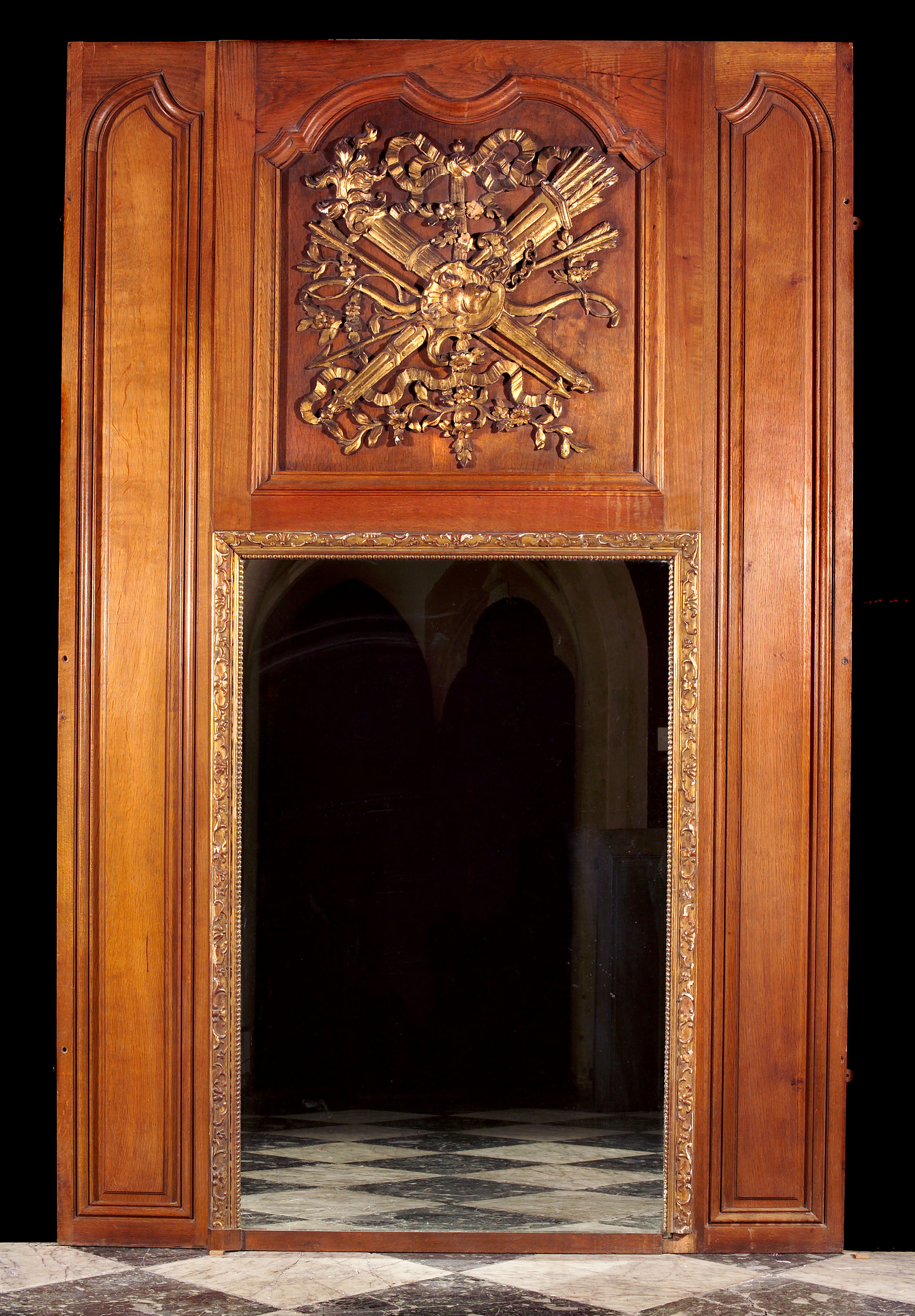 A Louis XVI oak overmantel mirror