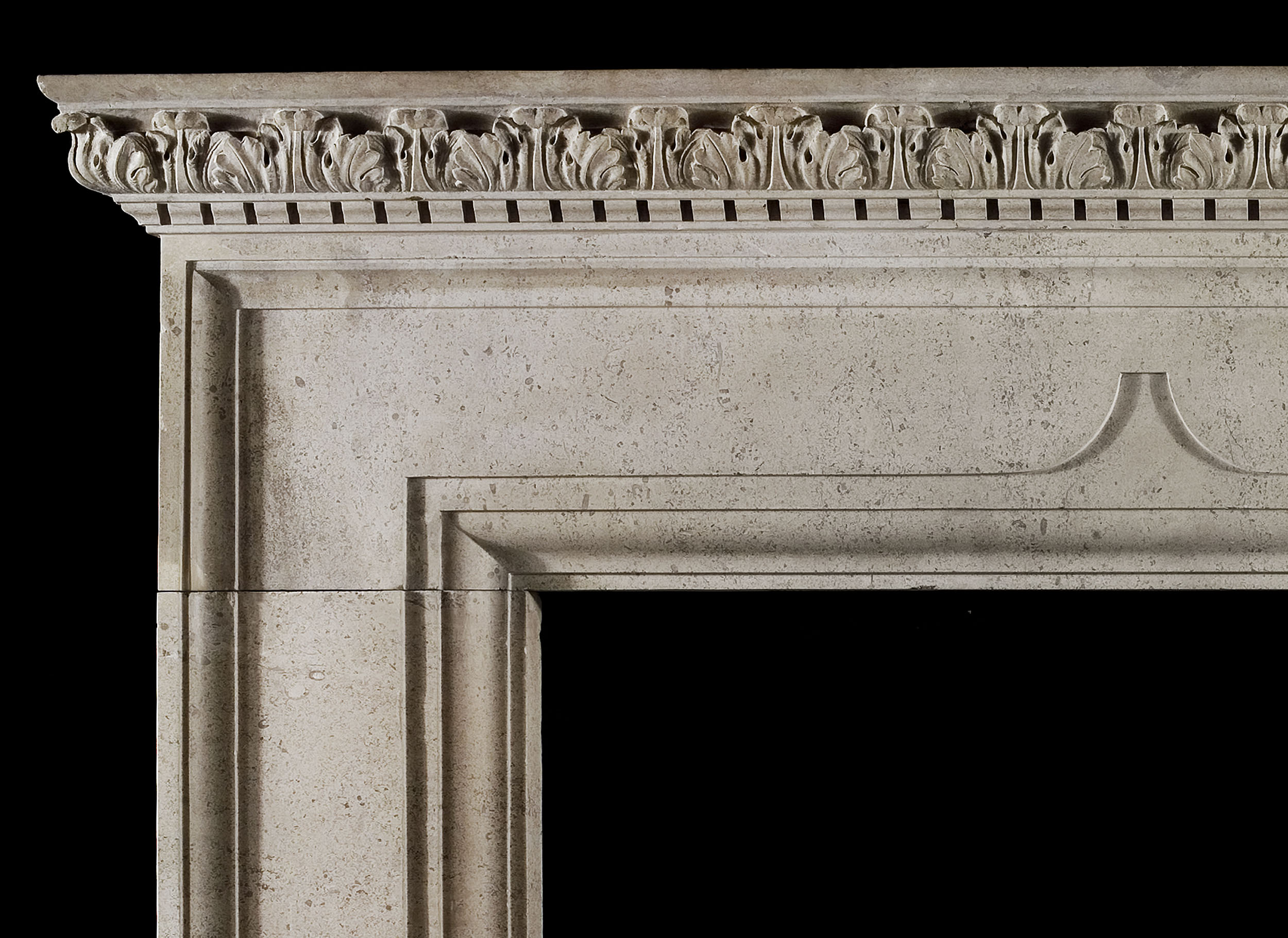 A late 19th century Queen Anne style Baroque stone chimneypiece 
