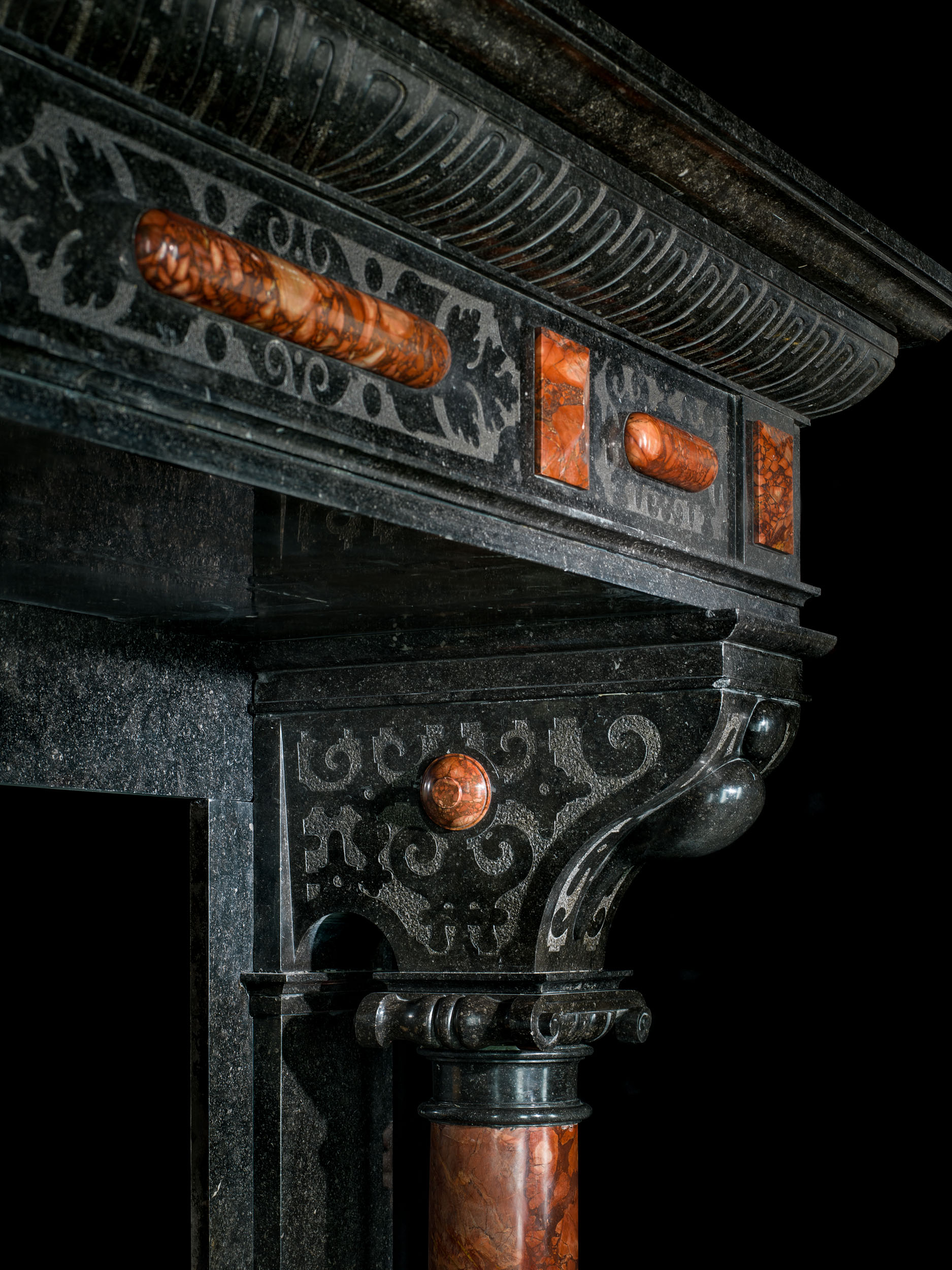 Antique Flemish Black Fossil Marble Renaissance style fireplace.
