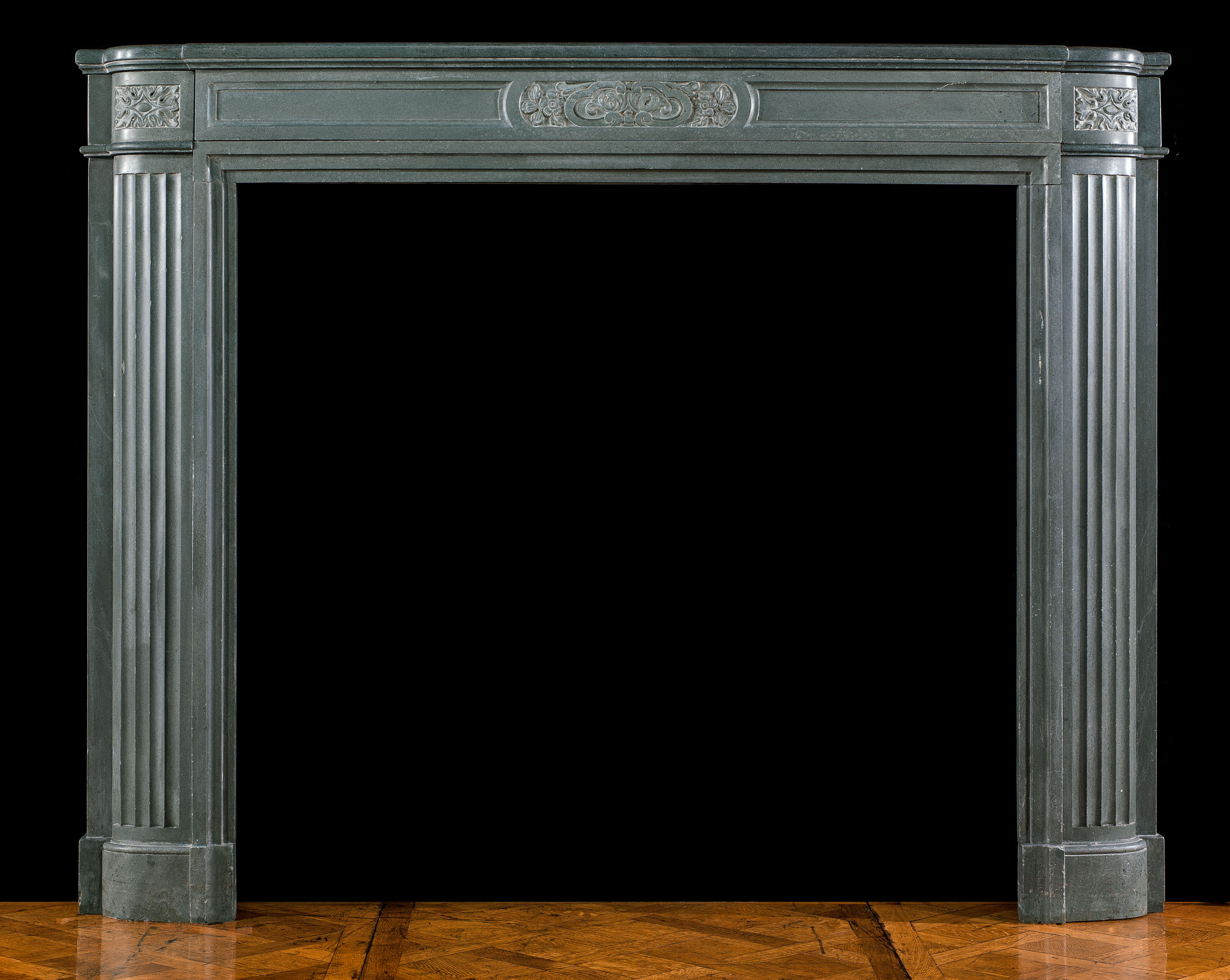 A stone chimneypiece of the Art Deco period 