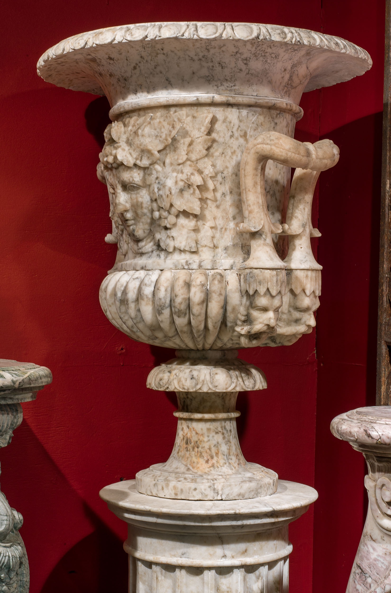 A pair of fine antique alabaster urns mounted on their original pedestals