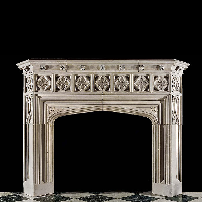  A limestone Gothic Revival fireplace mantel.