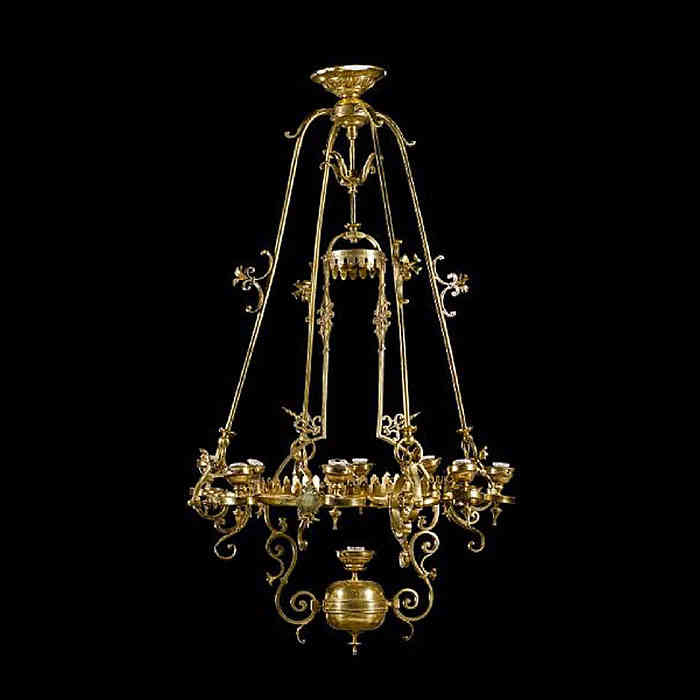 An eight light brass antique chandelier