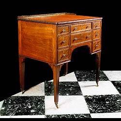 A Small Satinwood Regency Kneehole Desk