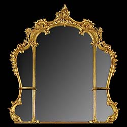  A giltwood and composition English Rococo mirror   