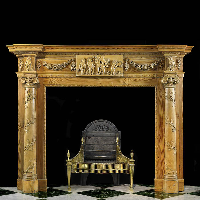 Antique Pine Georgian Chimneypiece with Columned Jambs and Cherubs 
