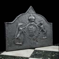 A wide cast iron heraldic fireback