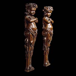  A pair of antique Italian carved walnut caryatid    