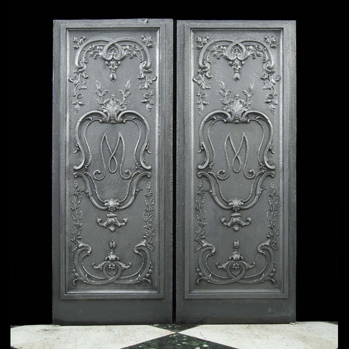 A pair of 19th century monogrammed fireplace panels 