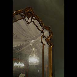 Antique French Rococo Louis XV Wood Frame Mirror
 This Overmantel Mirror is in the Louis XV Rococo style with a Gilt wood frame. 19th century.
