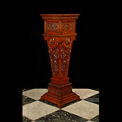 A richly carved antique Victorian walnut pedestal 