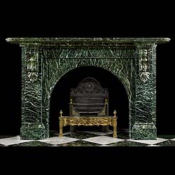 An arched green Verde Antico antique fireplace surround 