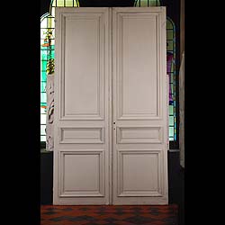 Antique Louis XVI style French Oak Doors, painted white
 An Antique Pair of Oak doors in a French, Louis XVI manner, with surrounding Pine Moulding, and painted on both sides. French 19th century.
